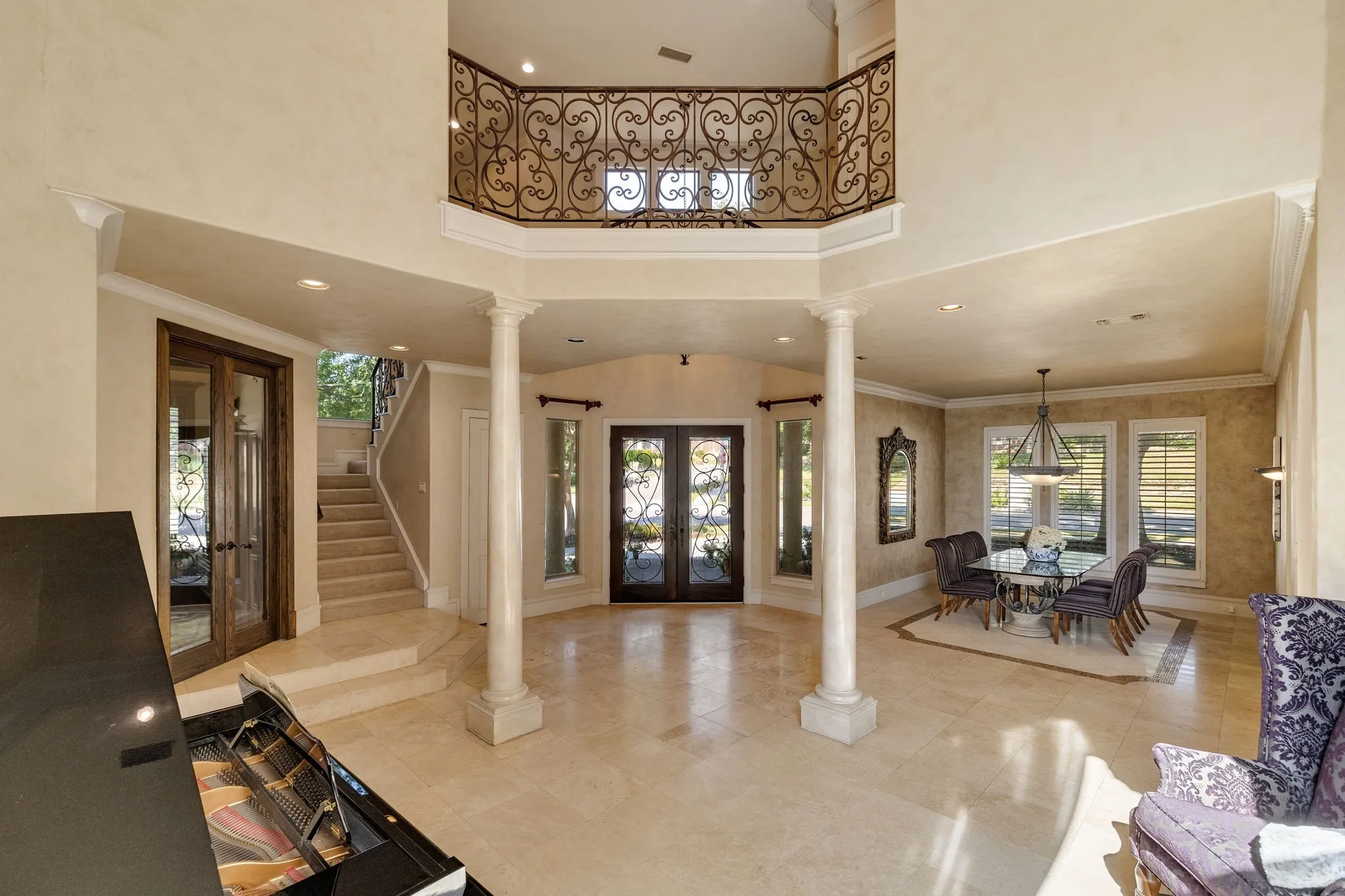Entry with 2nd story balcony and architectural detailings.