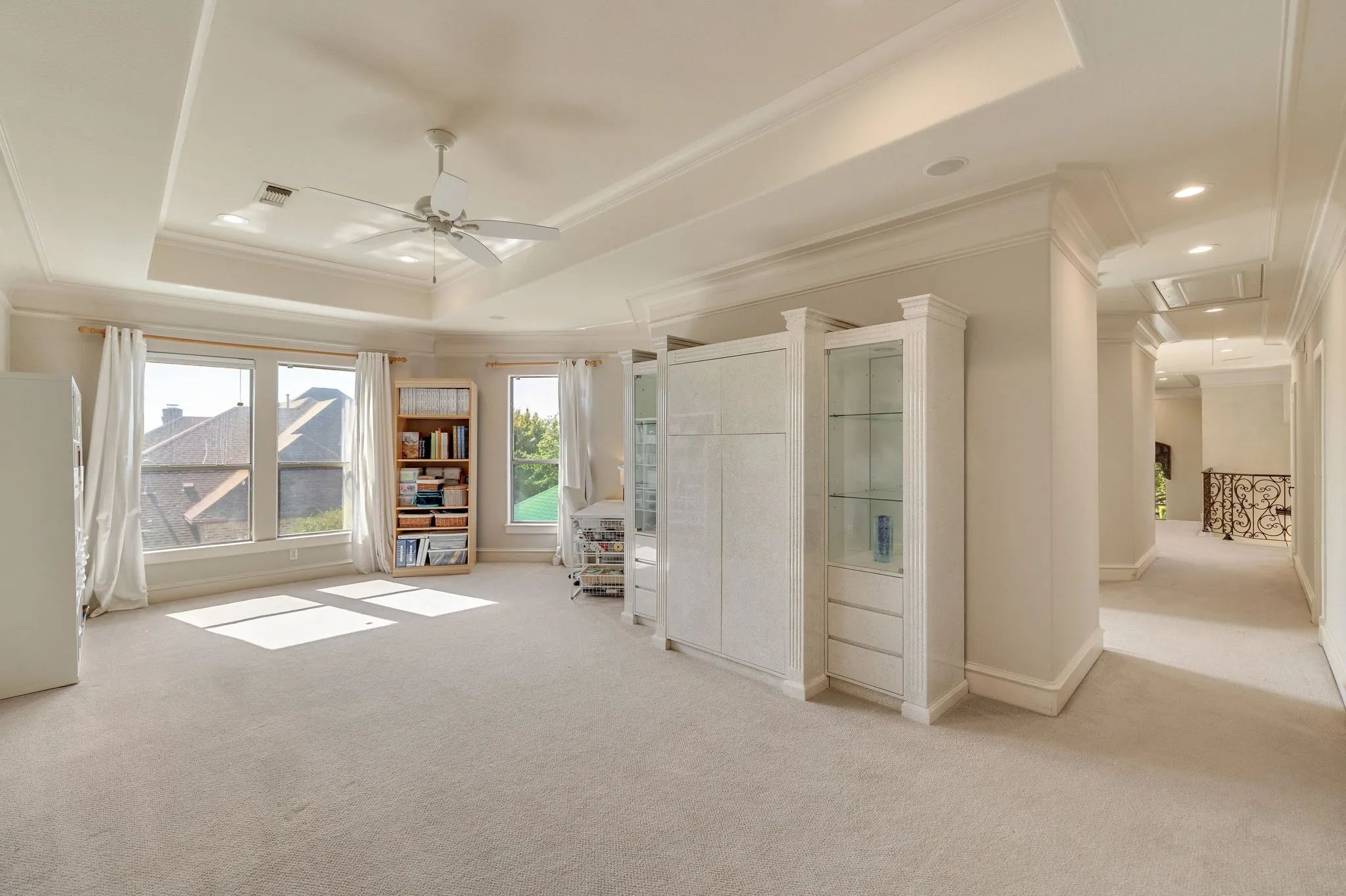 Impressive game room with trey ceiling and natural light.