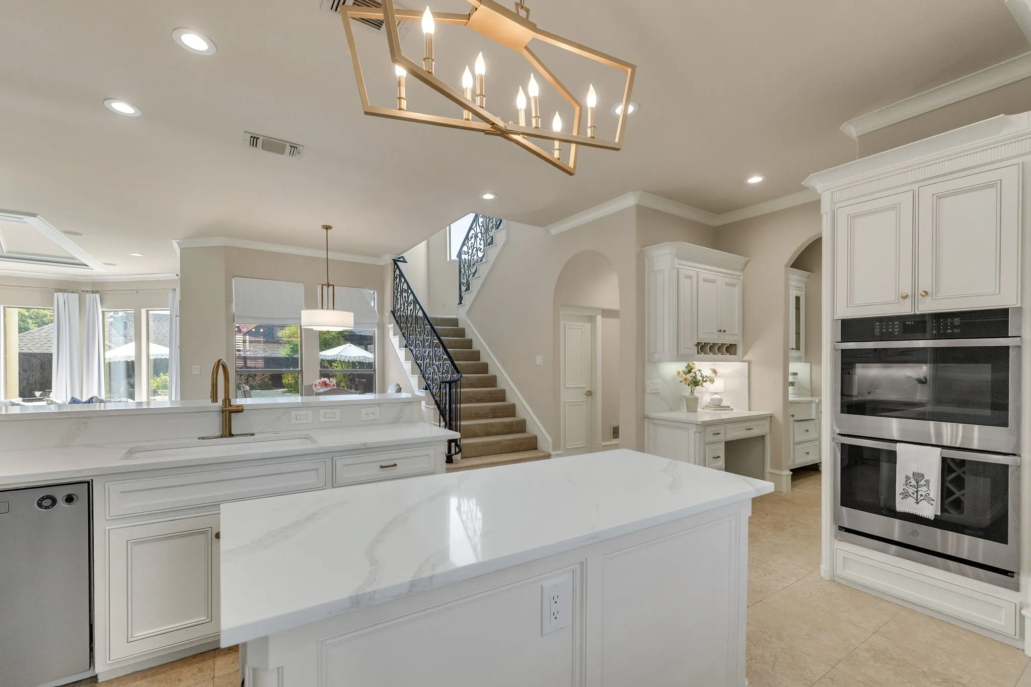 Kitchen flows seamlessly to living room.