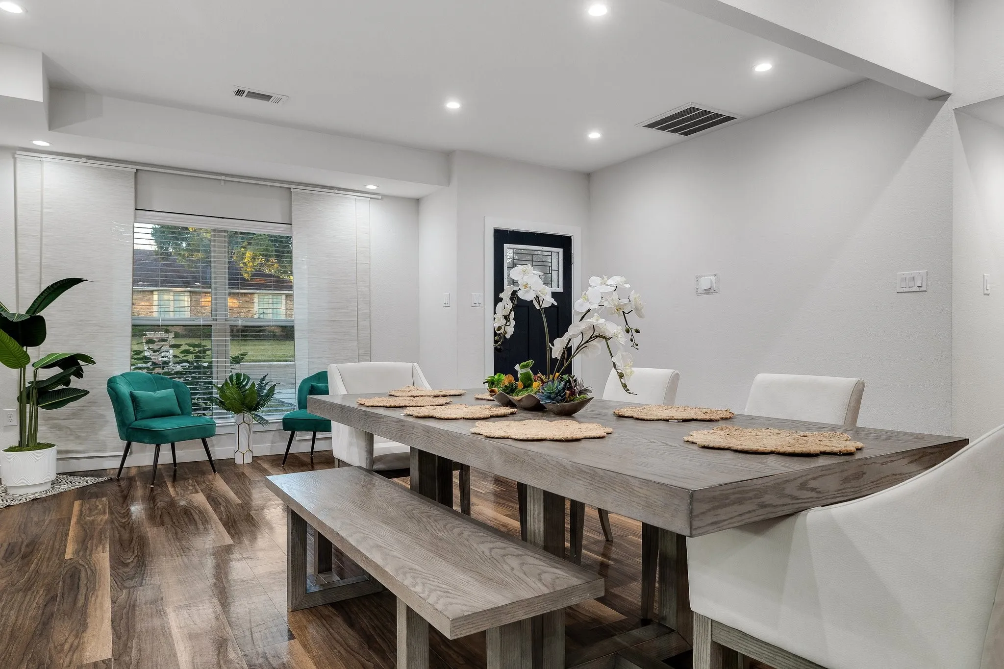 Recessed lighting, wood-finish flooring, and a window with blinds