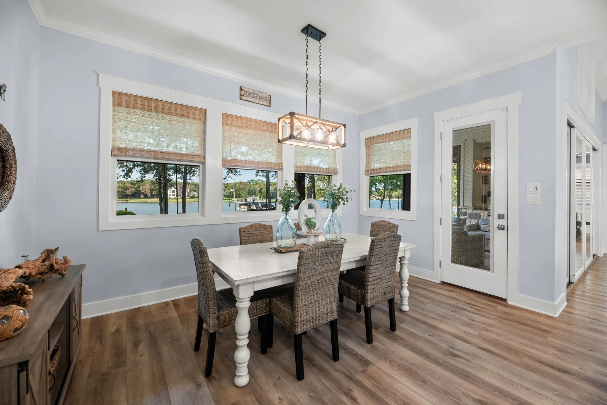 Charming dining area offers a comfortable gathering space with natural light and easy access to the kitchen and outdoor living areas.