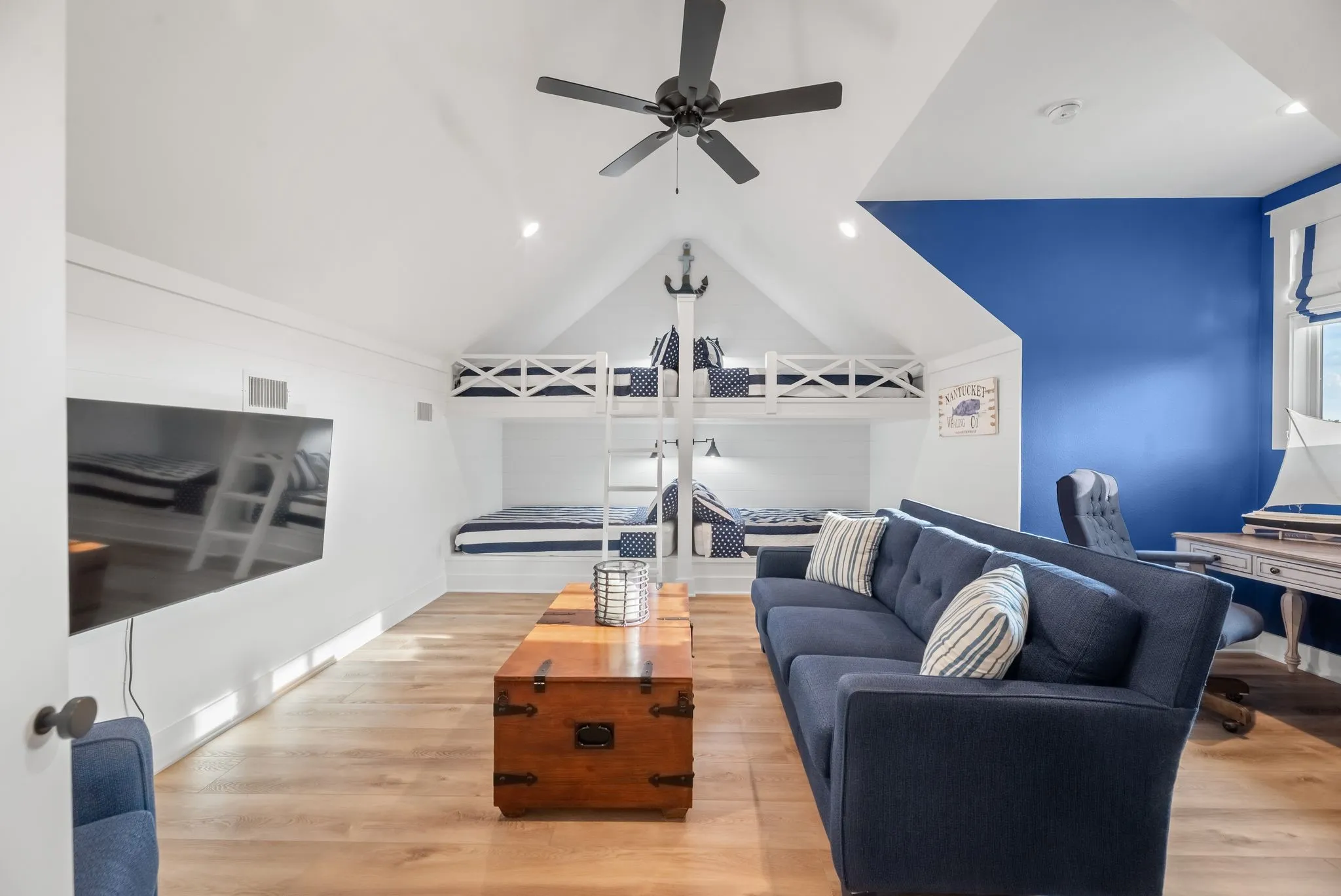 Spacious upstairs bunk room offers built-in sleeping accommodations, and flexible space for guests or recreation.