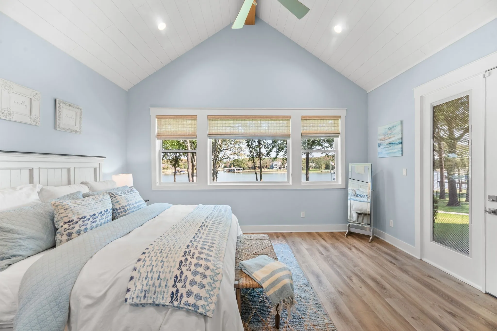 Light-filled primary suite creates a relaxing retreat with generous proportions and easy access to the outdoor living spaces.