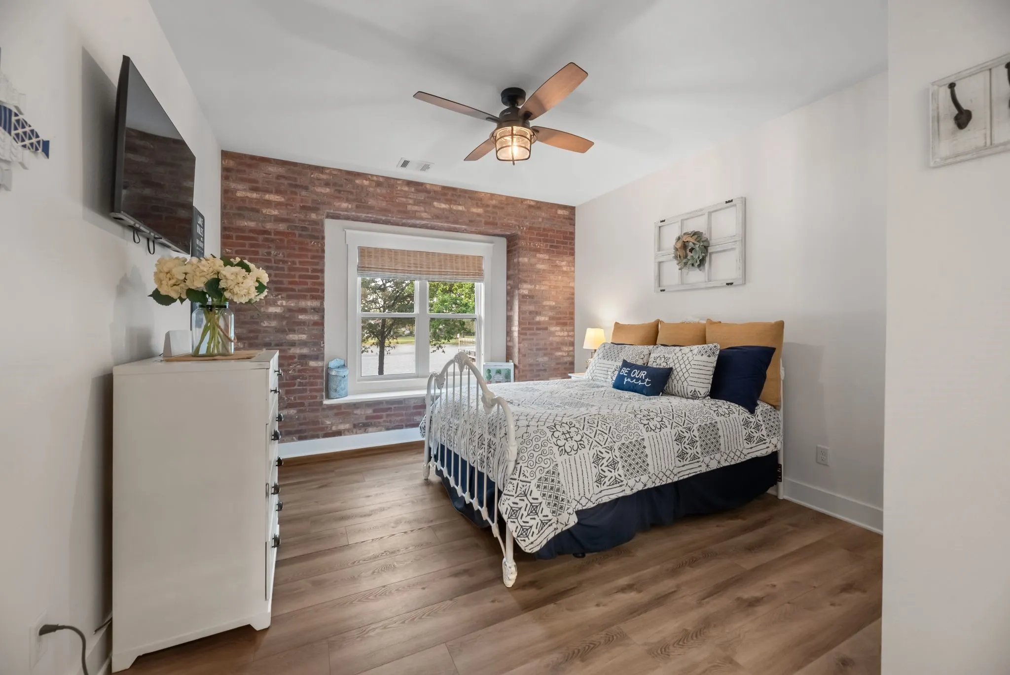 Inviting secondary bedroom provides a comfortable private retreat for guests in this four-bedroom Richland Chambers Lake home.
