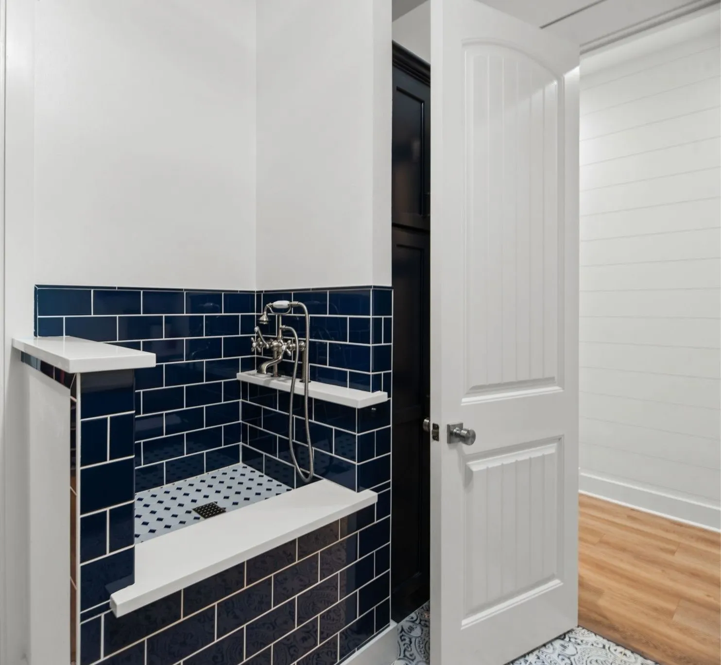 Convenient pet washing station adds a thoughtful custom feature for an active lake lifestyle and four-legged family members.