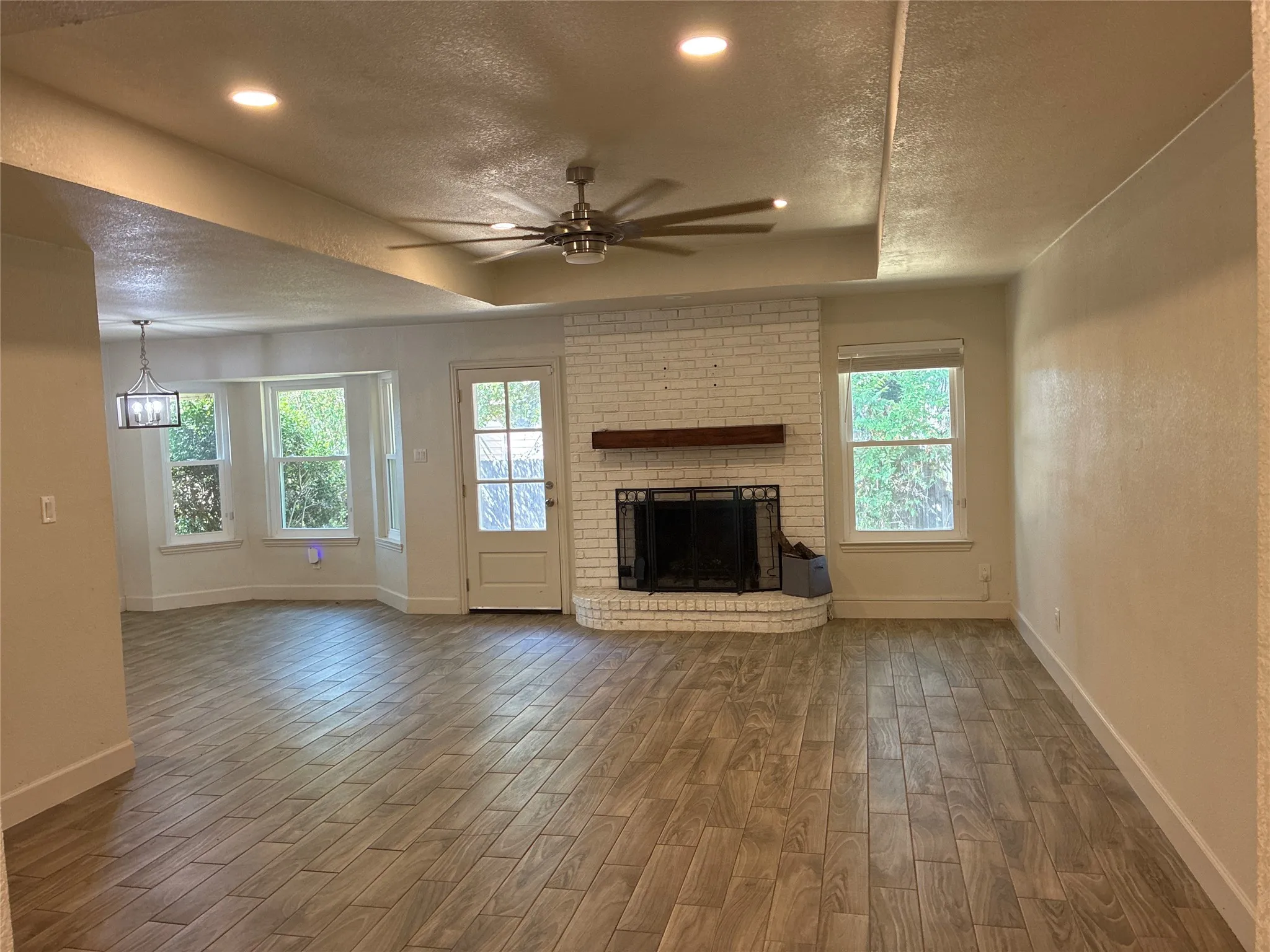 Wood-finish plank flooring throughout