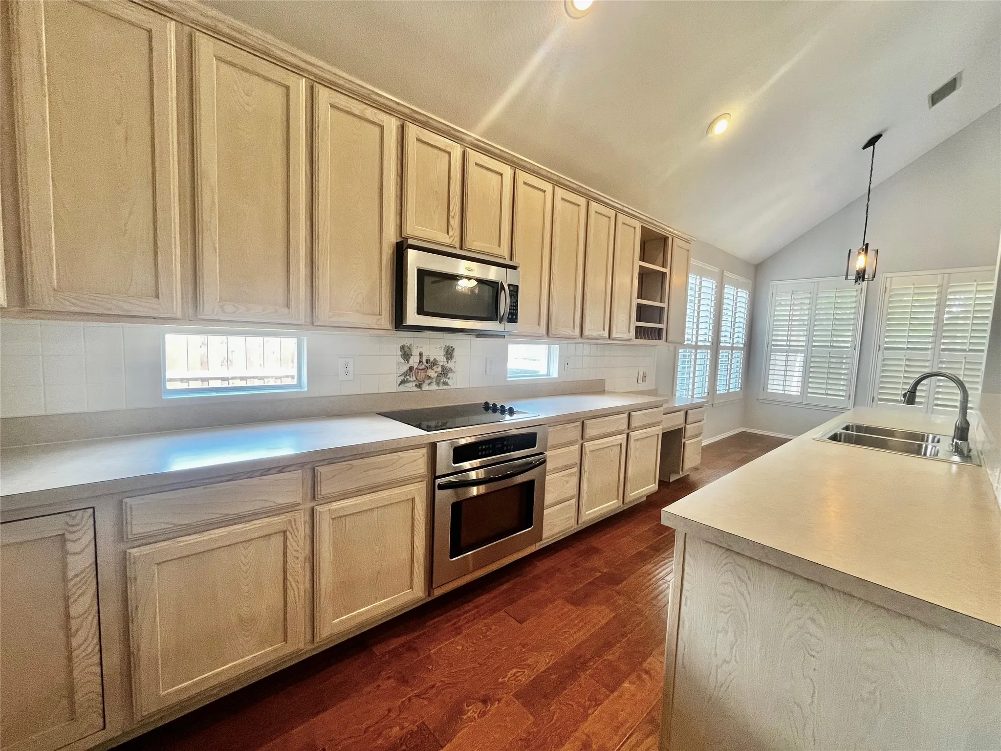 stainless appliances, sink, faucet, microwave, oven is also a convection oven.  Love these transom windows for extra light!
