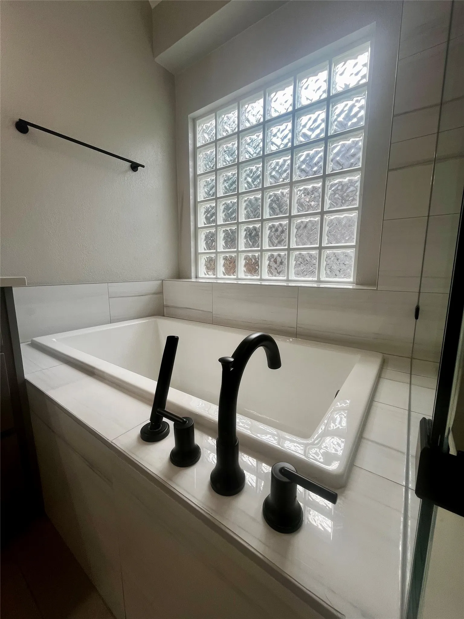 Garden tub with spray feature