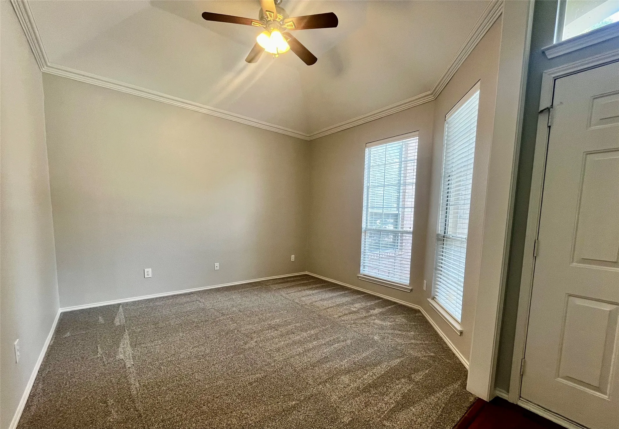 Living room overlooks front of home.  This makes a great office or playroom.