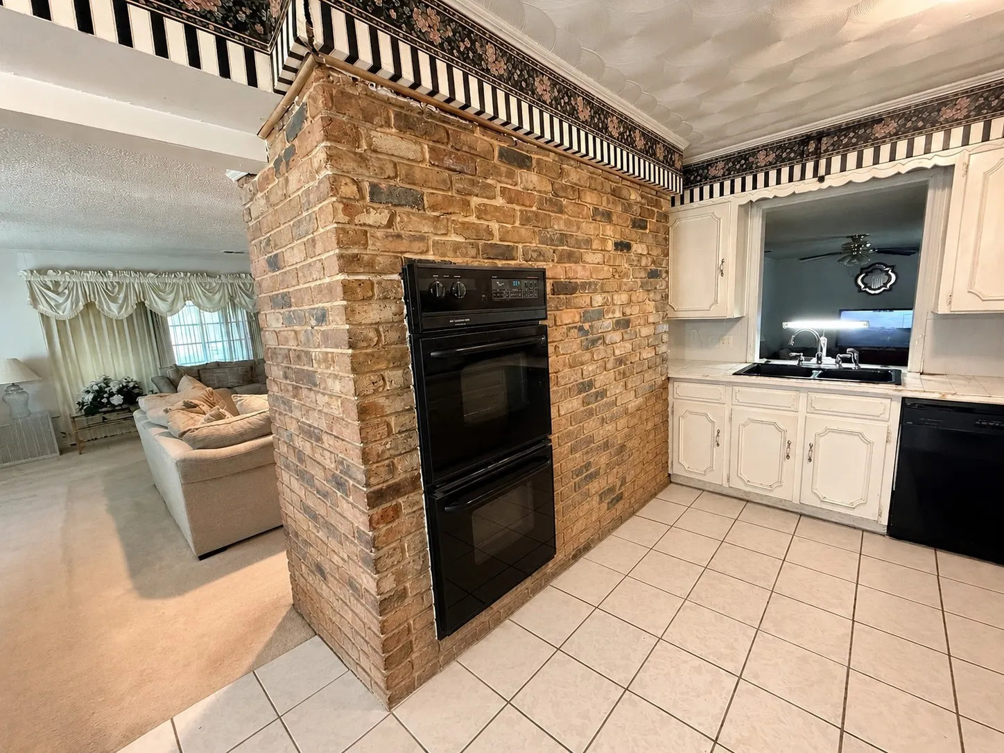 Brick feature wall with dual built-in ovens