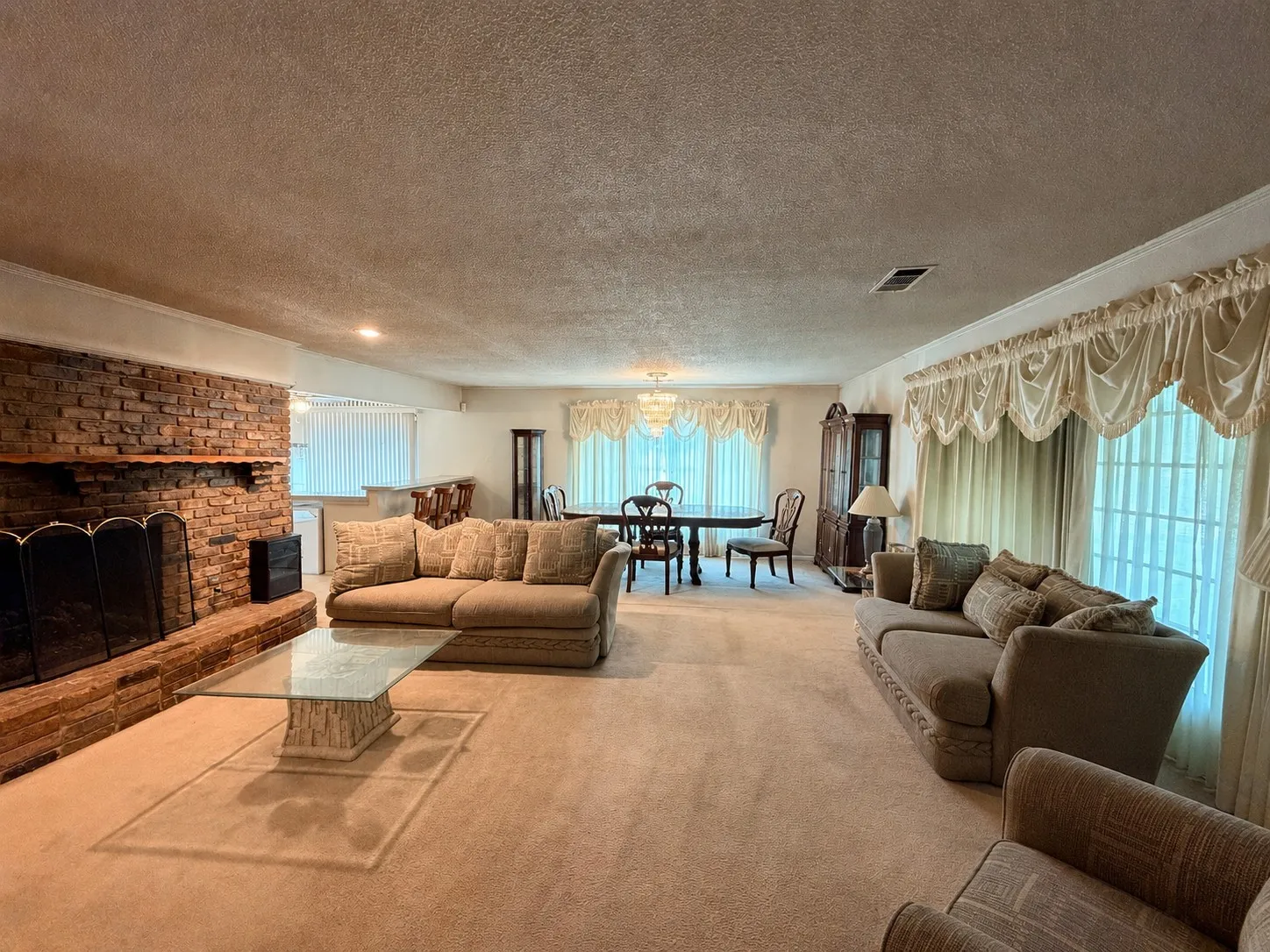 Brick fireplace with wood mantel