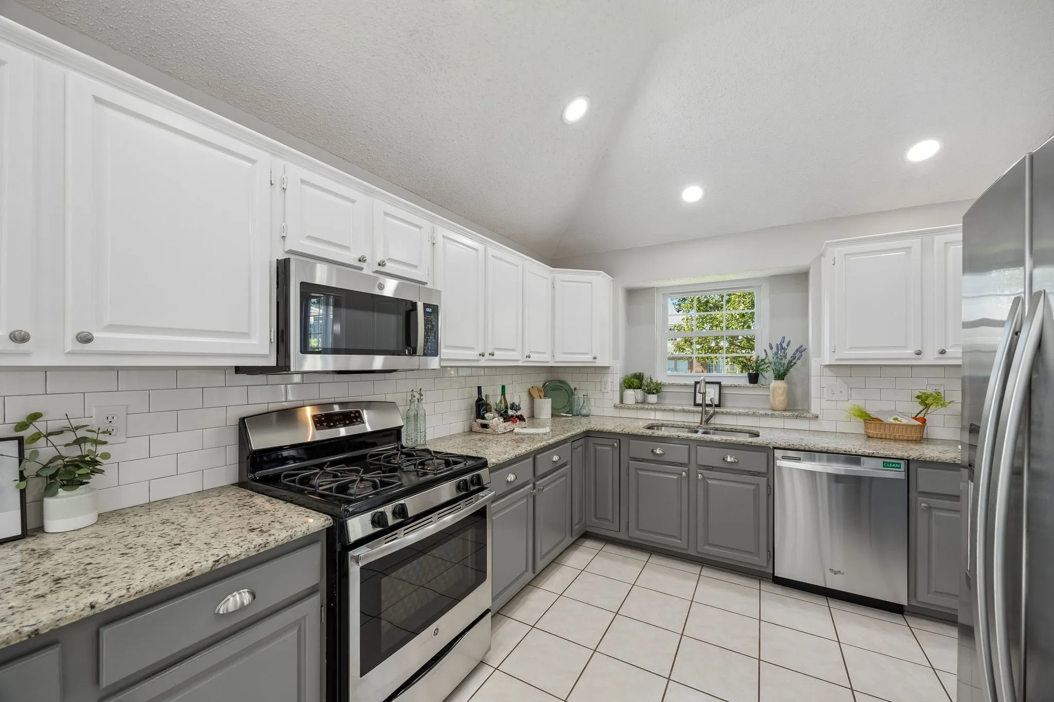 Here is another view of how large and appealing this kitchen is - the side-by-side refrigerator stays with the home!