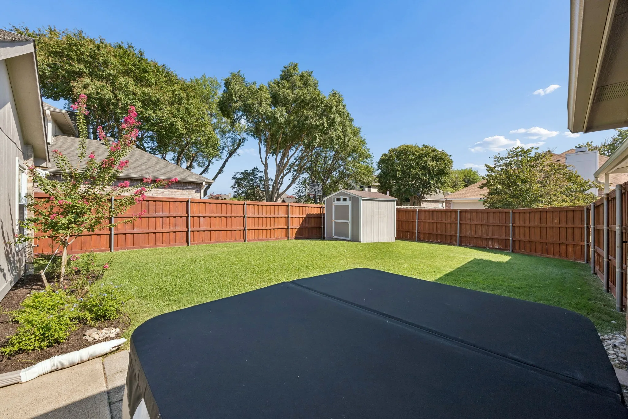 Love this spacious backyard!  Don't miss the Anchored and Vented 8x10 “Tuff Shed” Storage Building