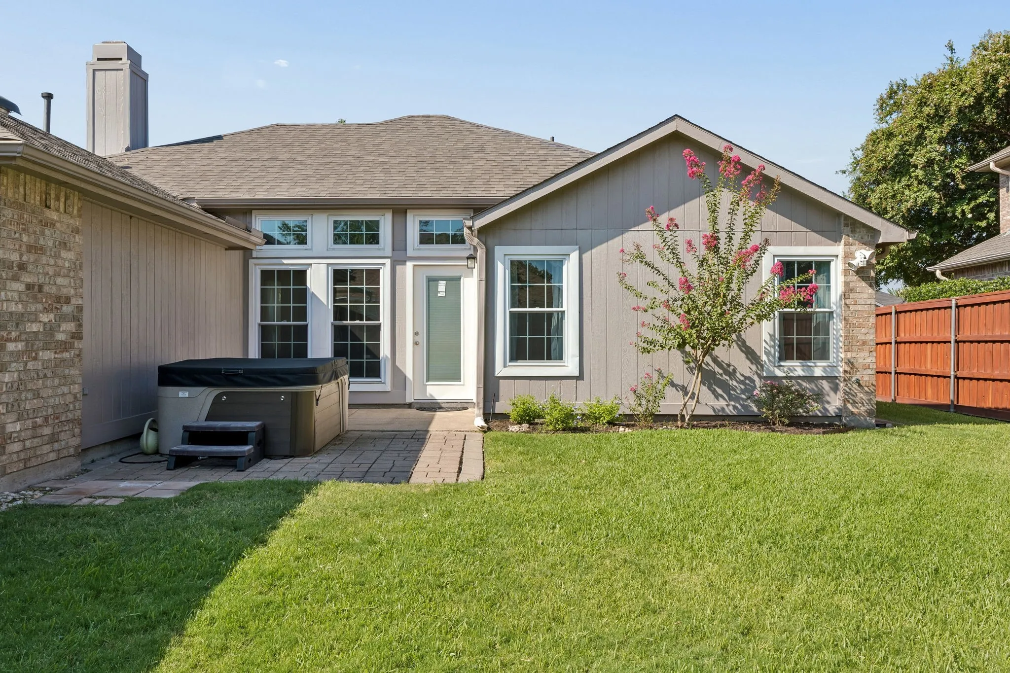 A view of your back patio - lovely landscaping here, too!