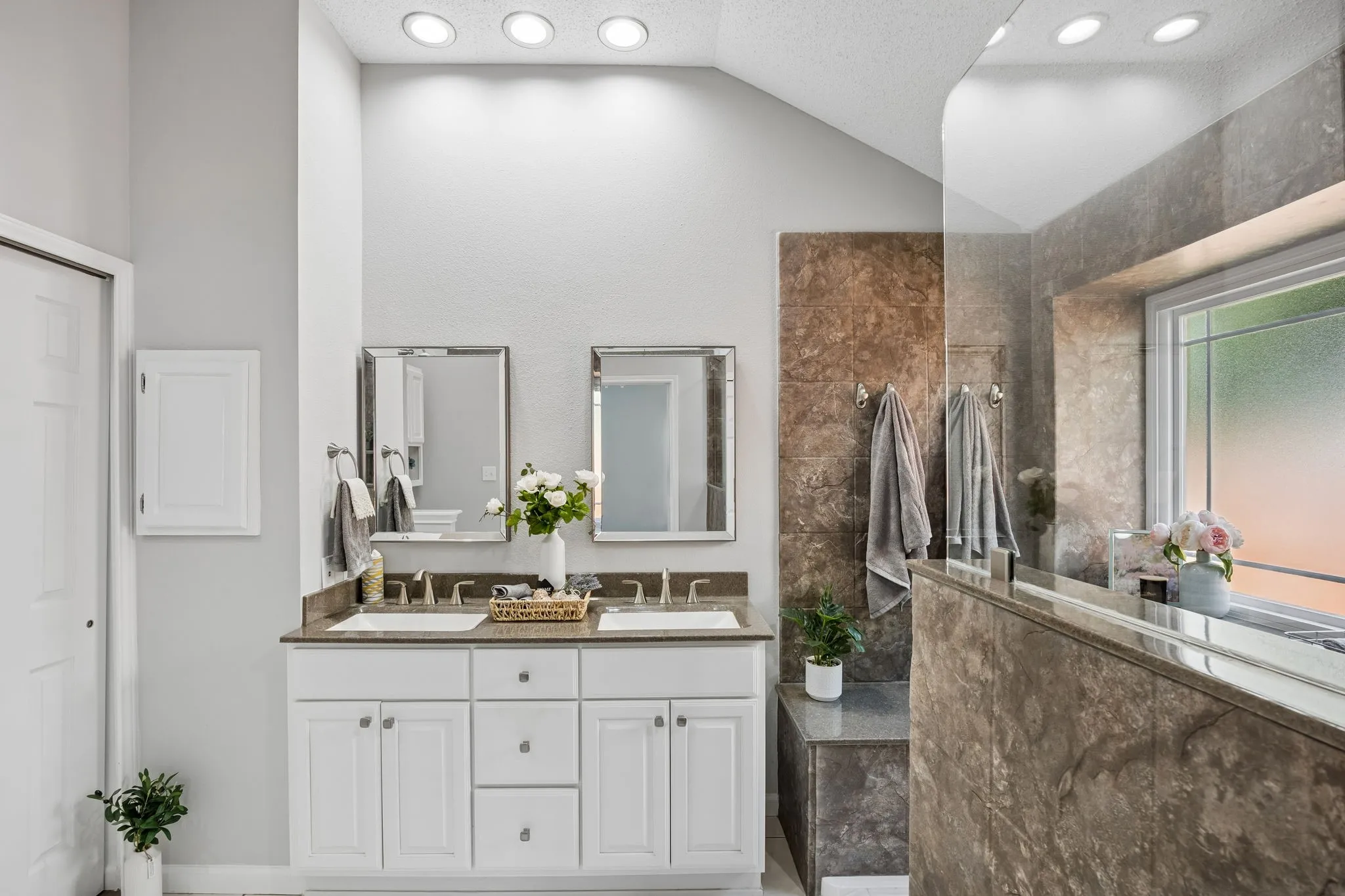 Here is a closer look at the beautiful finishes - elegant recessed lighting and luxurious shower.