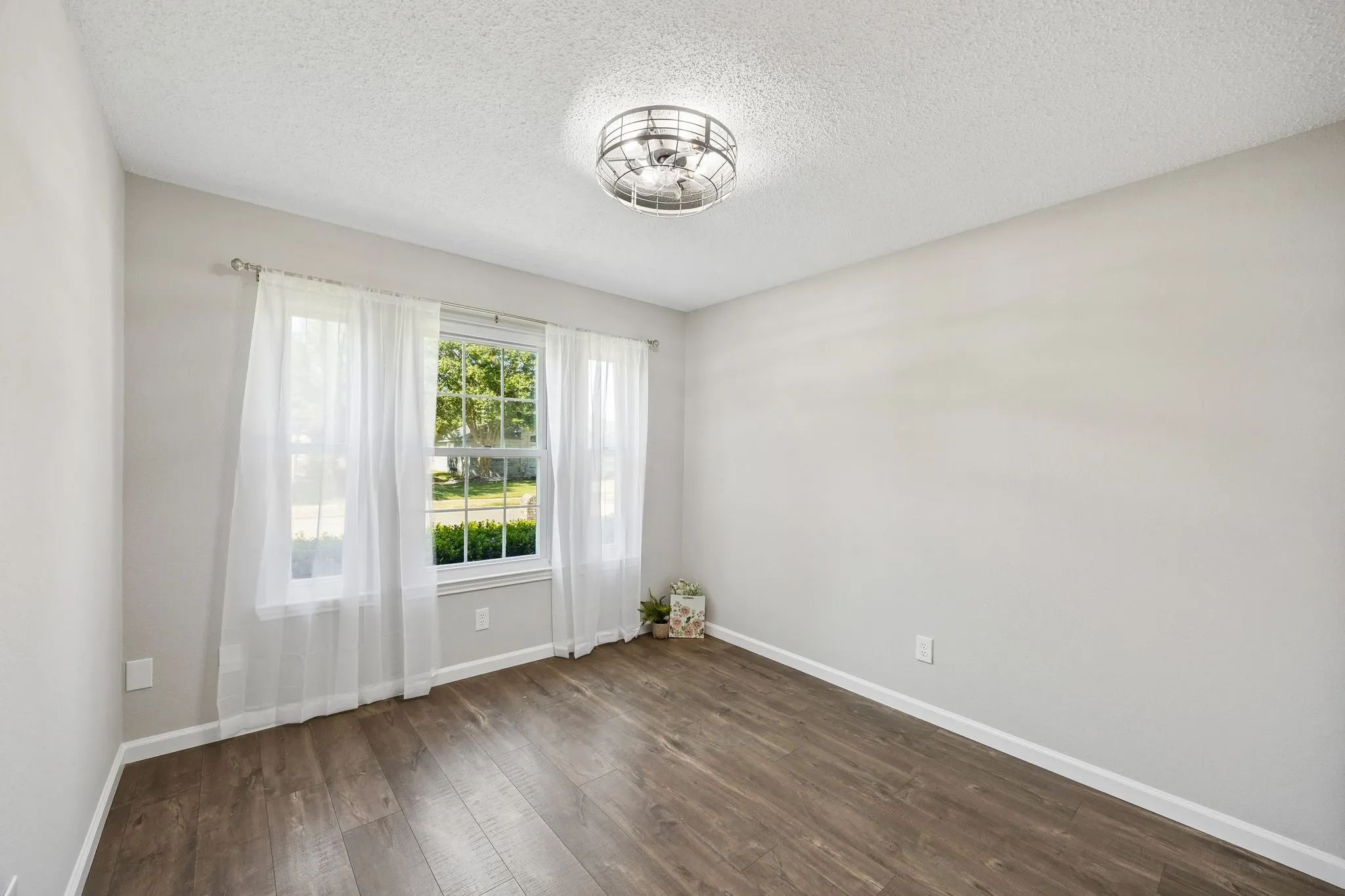 This is the 3rd bedroom - love the popular "cage" fan look!!