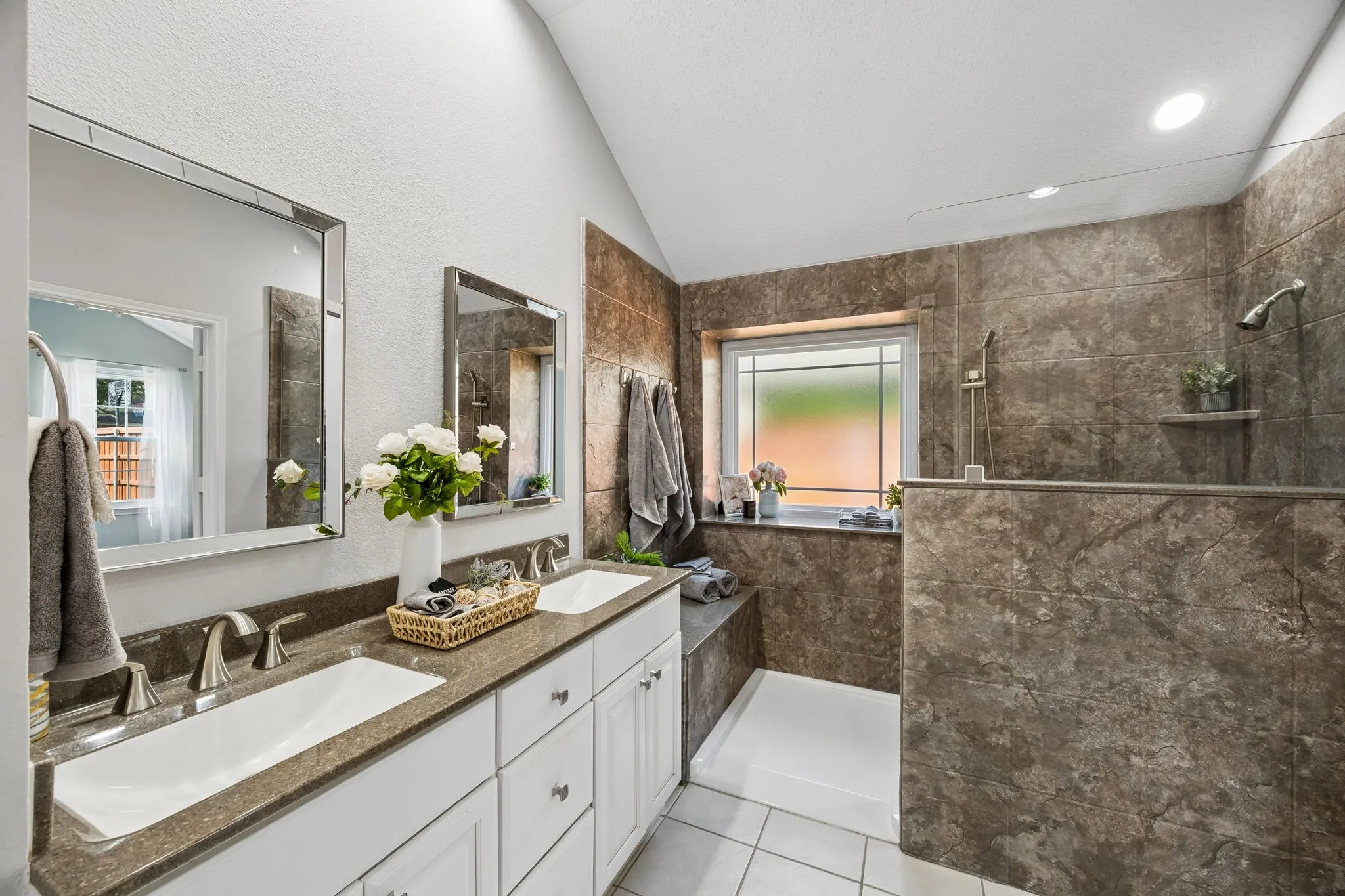 Dual sinks with quartz counter tops - brushed nickel faucets and NEW inspiriting mirrors!