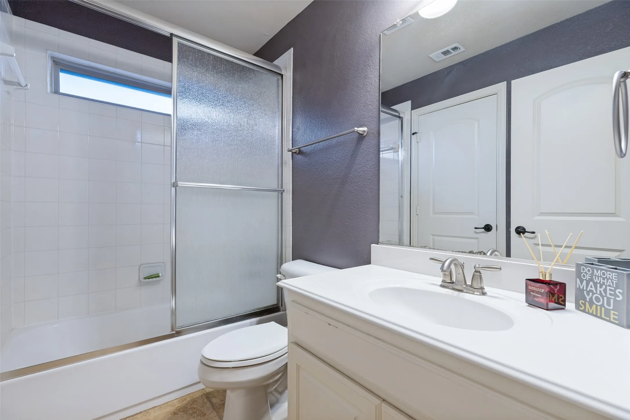 White vanity with an integrated sink and chrome faucet