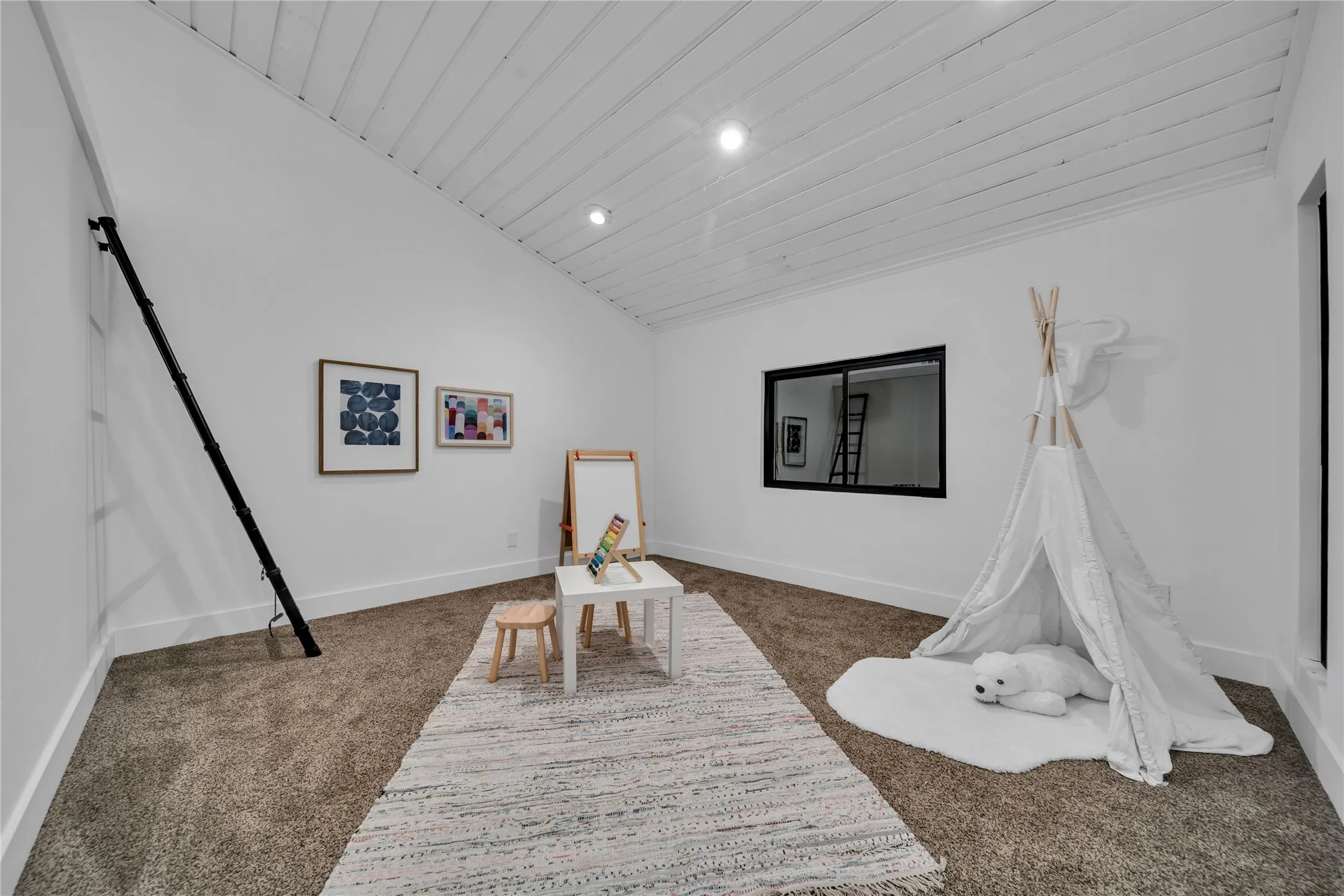 Playroom featuring carpet flooring, wood ceiling, baseboards, and vaulted ceiling