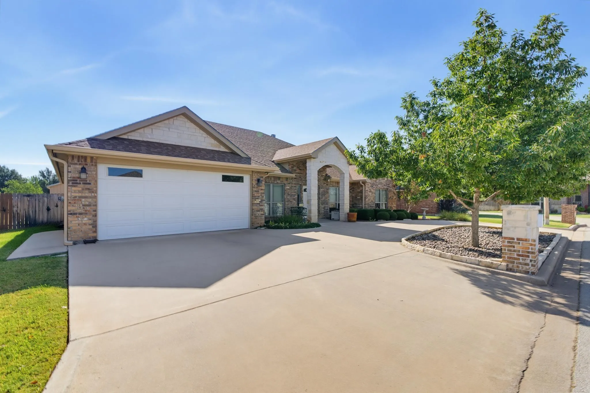 Brick and stone exterior with a two-car garage