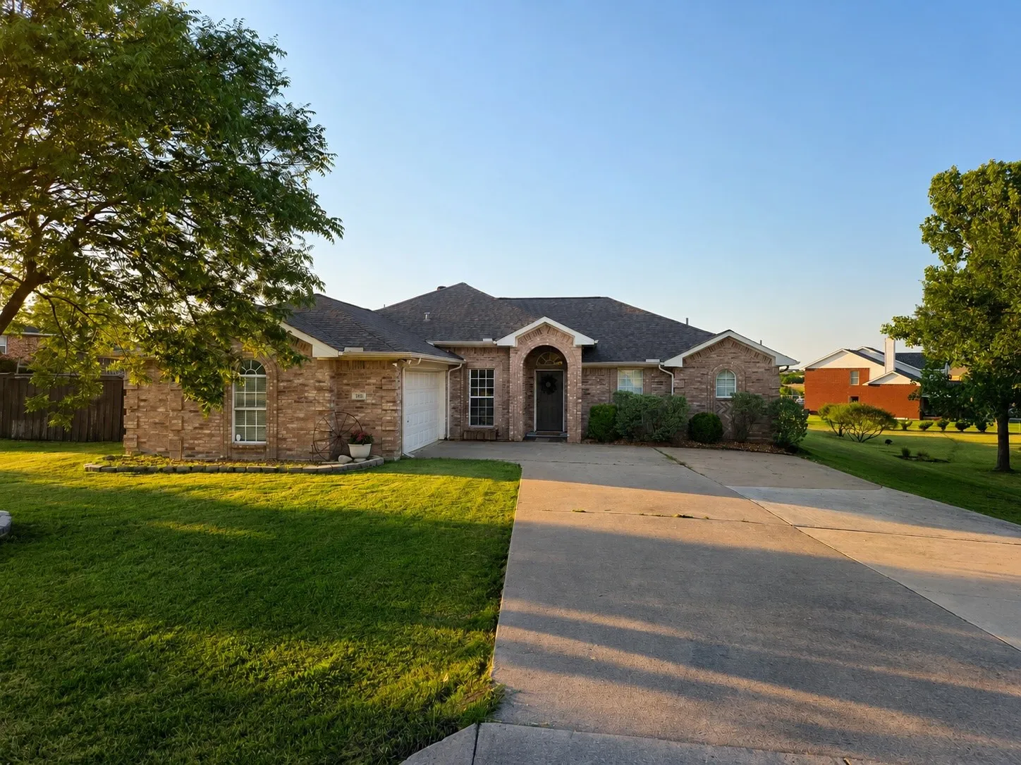 Traditional brick exterior with an arched entry