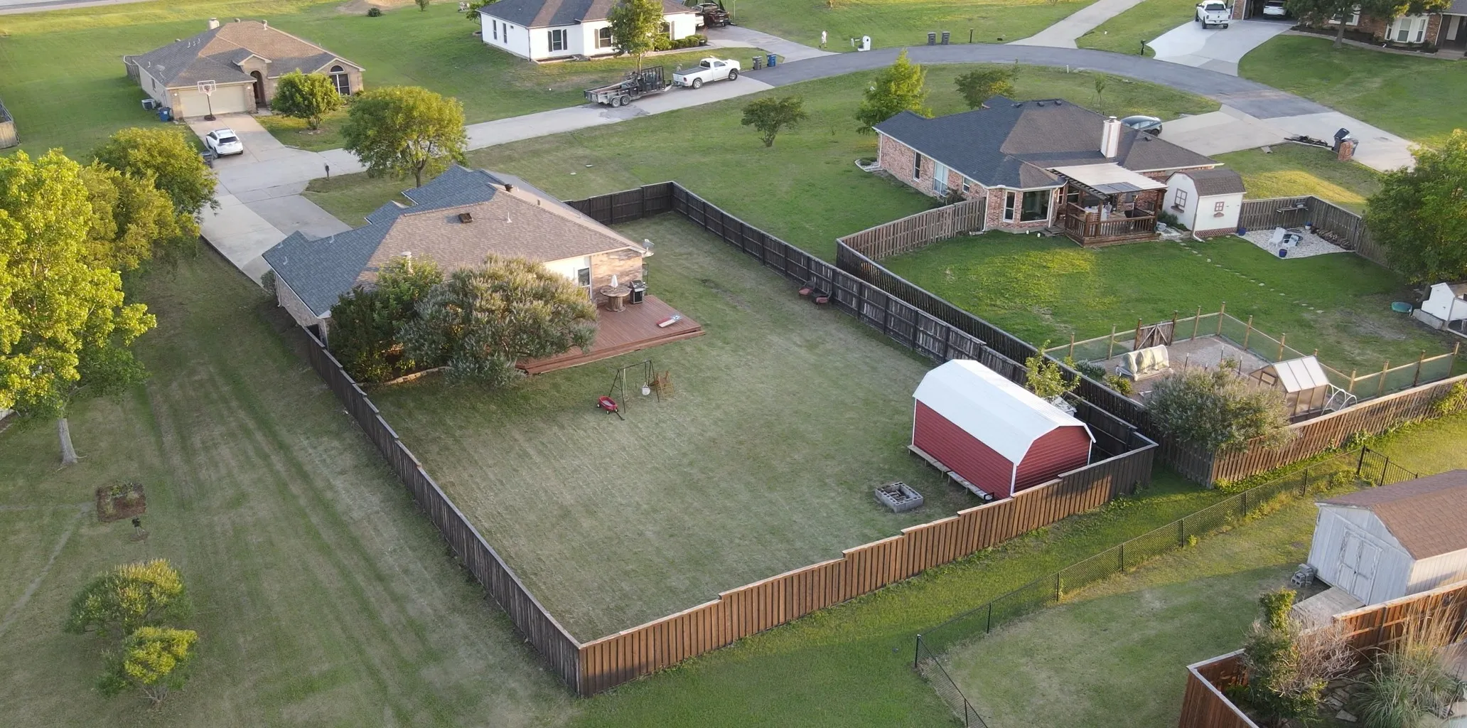 Expansive backyard featuring a full perimeter privacy fence
