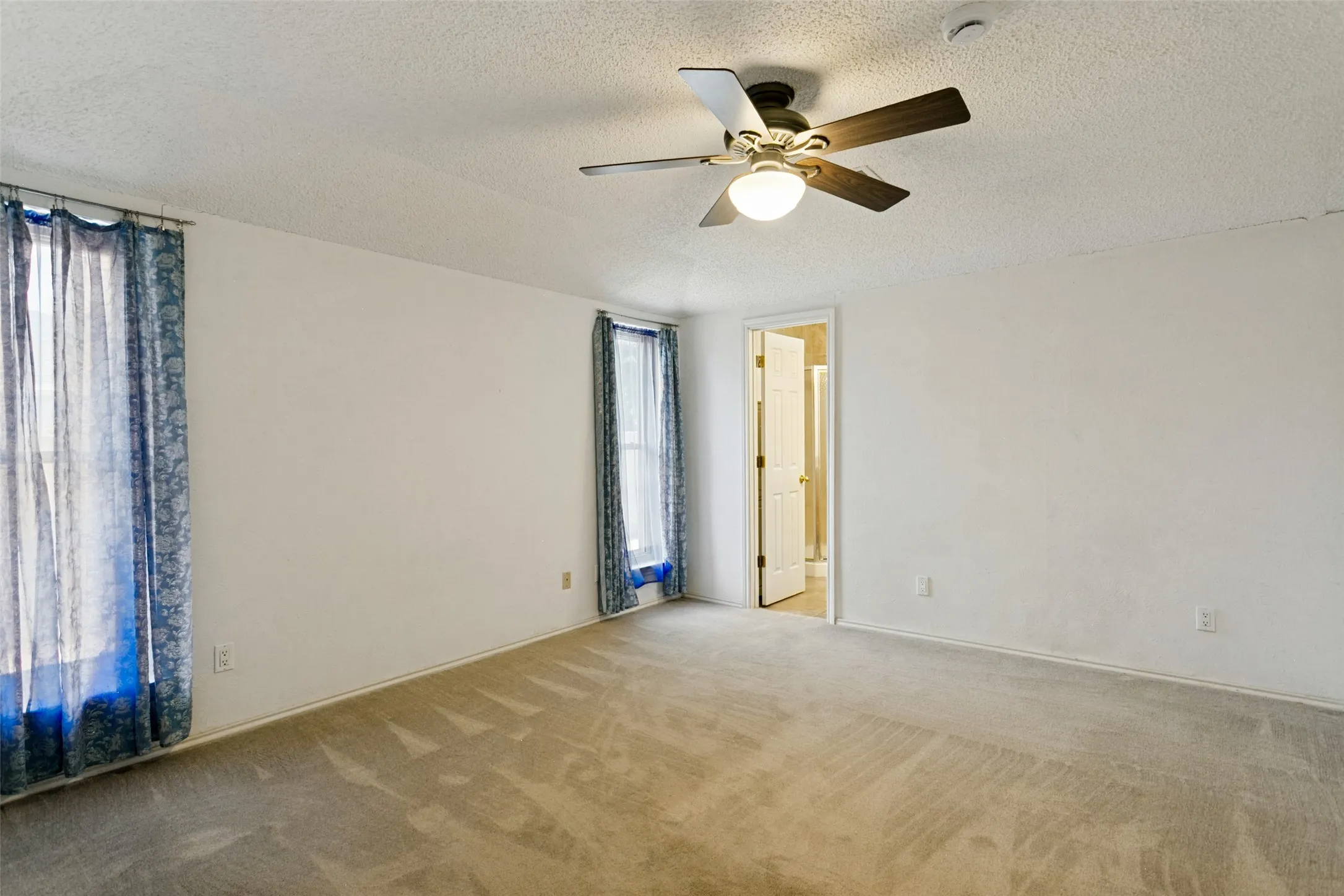 Recessed lighting, ceiling fan with integrated light fixture, carpeted flooring, and white painted walls