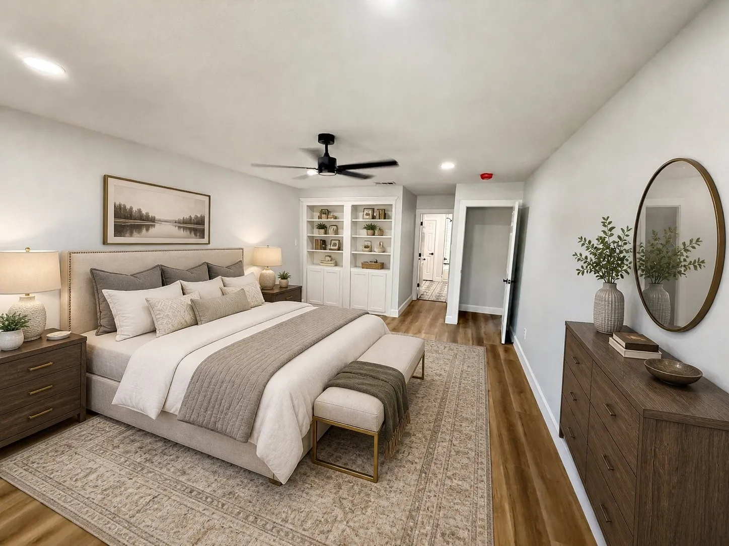 Recessed lighting, ceiling fan, built-in shelving, wood-finish flooring, and a flat-panel door