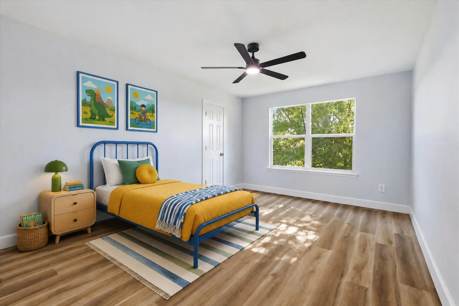 Expansive window with natural light, wood-finish flooring, white walls, and a ceiling fan with integrated lighting