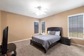 downstairs master with fresh paint and carpet