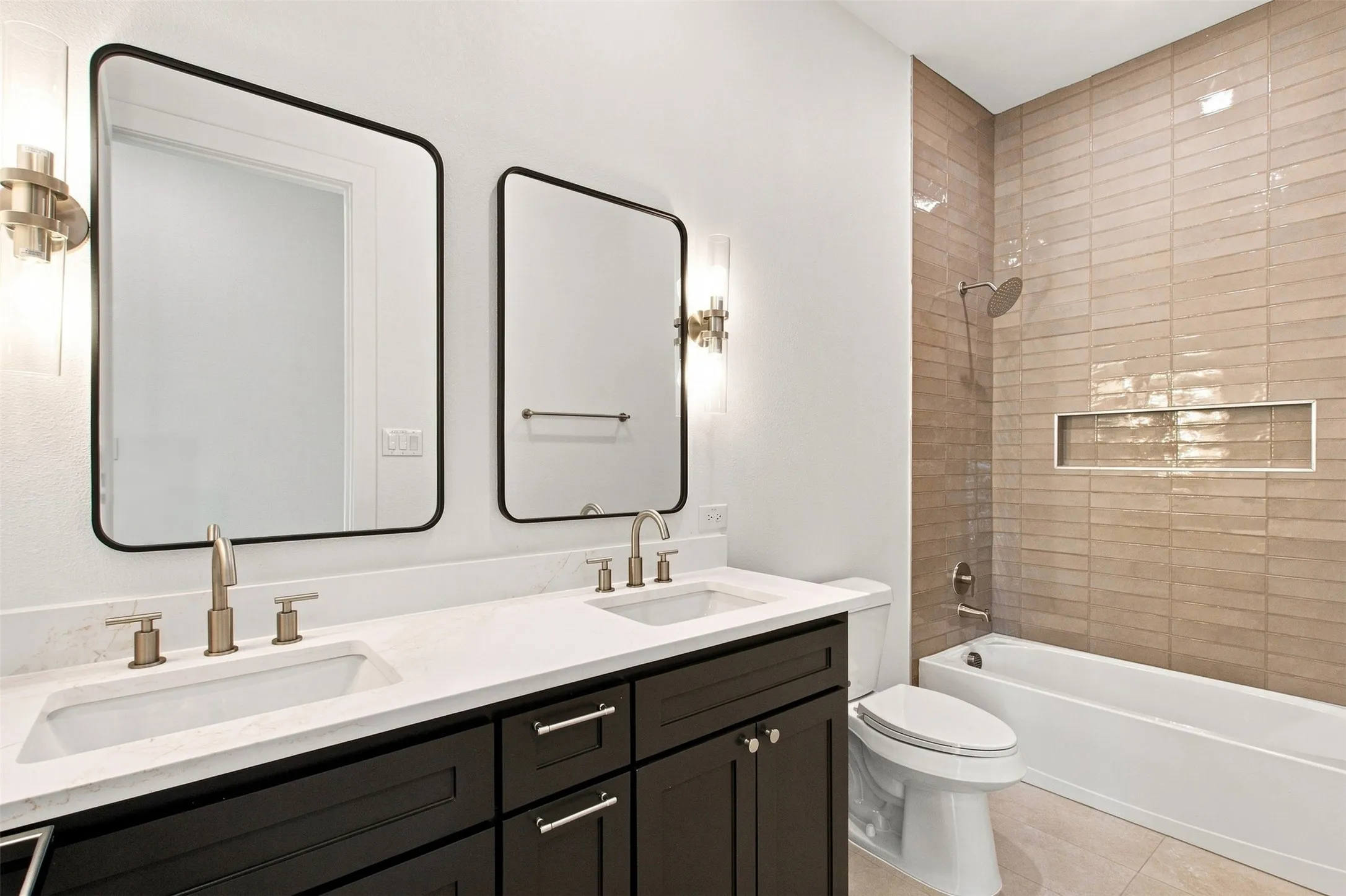 Dual vanity with undermount sinks, quartz countertop, and brushed nickel fixtures