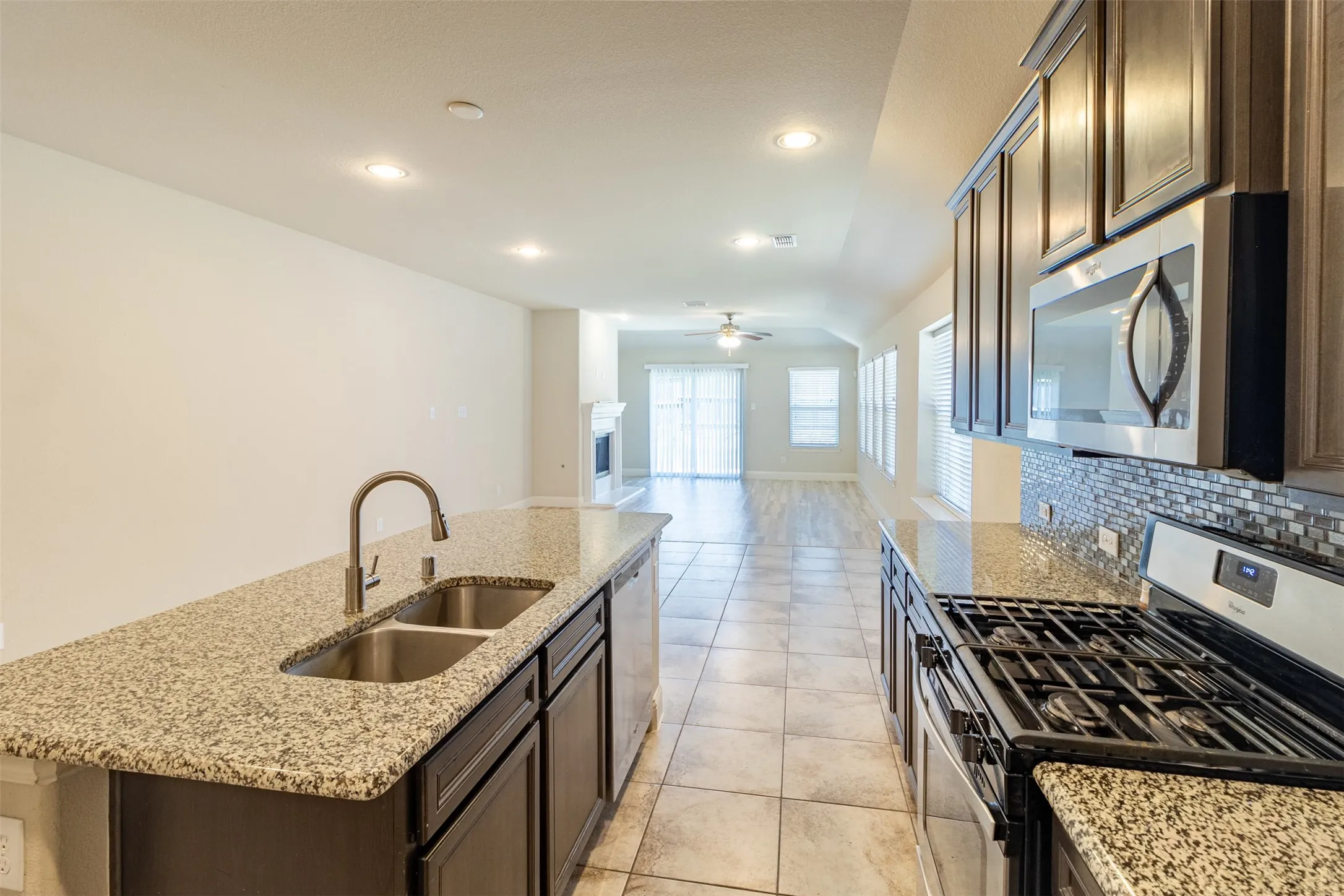 Kitchen island with dual basin stainless steel sink and granite countertop
