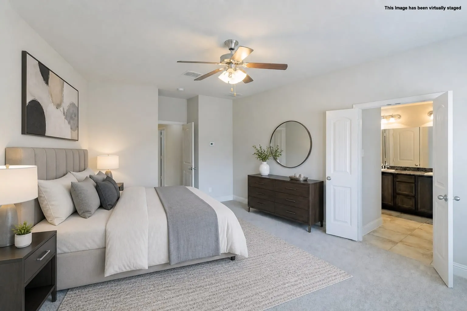 Virtual staged=>Light gray carpeting, white walls, and a ceiling fan with integrated lighting