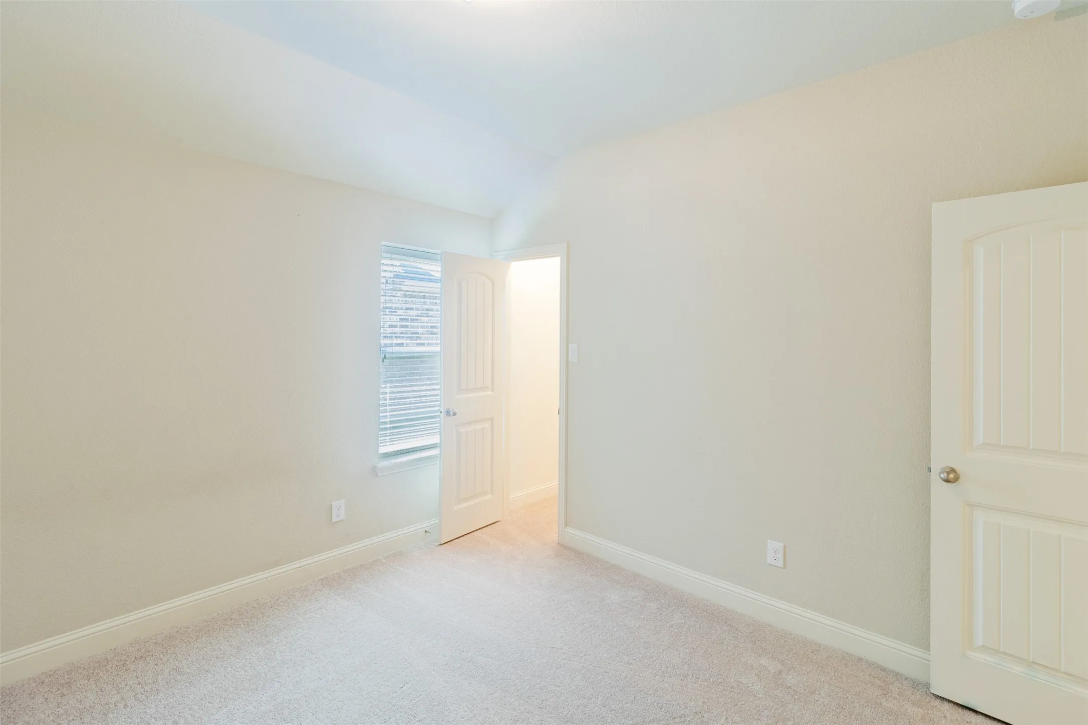 Bedroom #2 Vaulted ceiling, recessed lighting, window with blinds, interior door, light-toned wall color