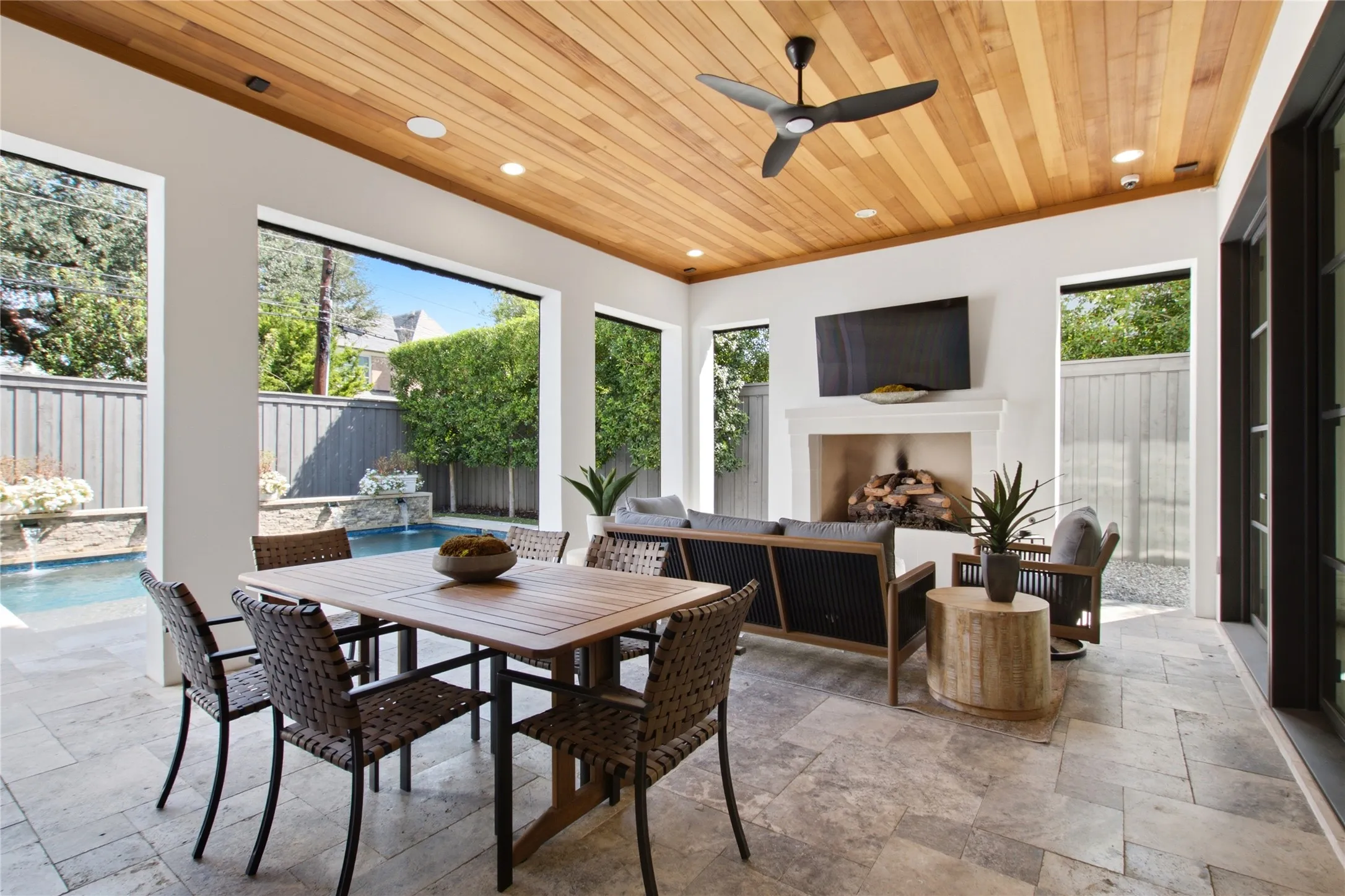 Lovely covered patio with electric shades