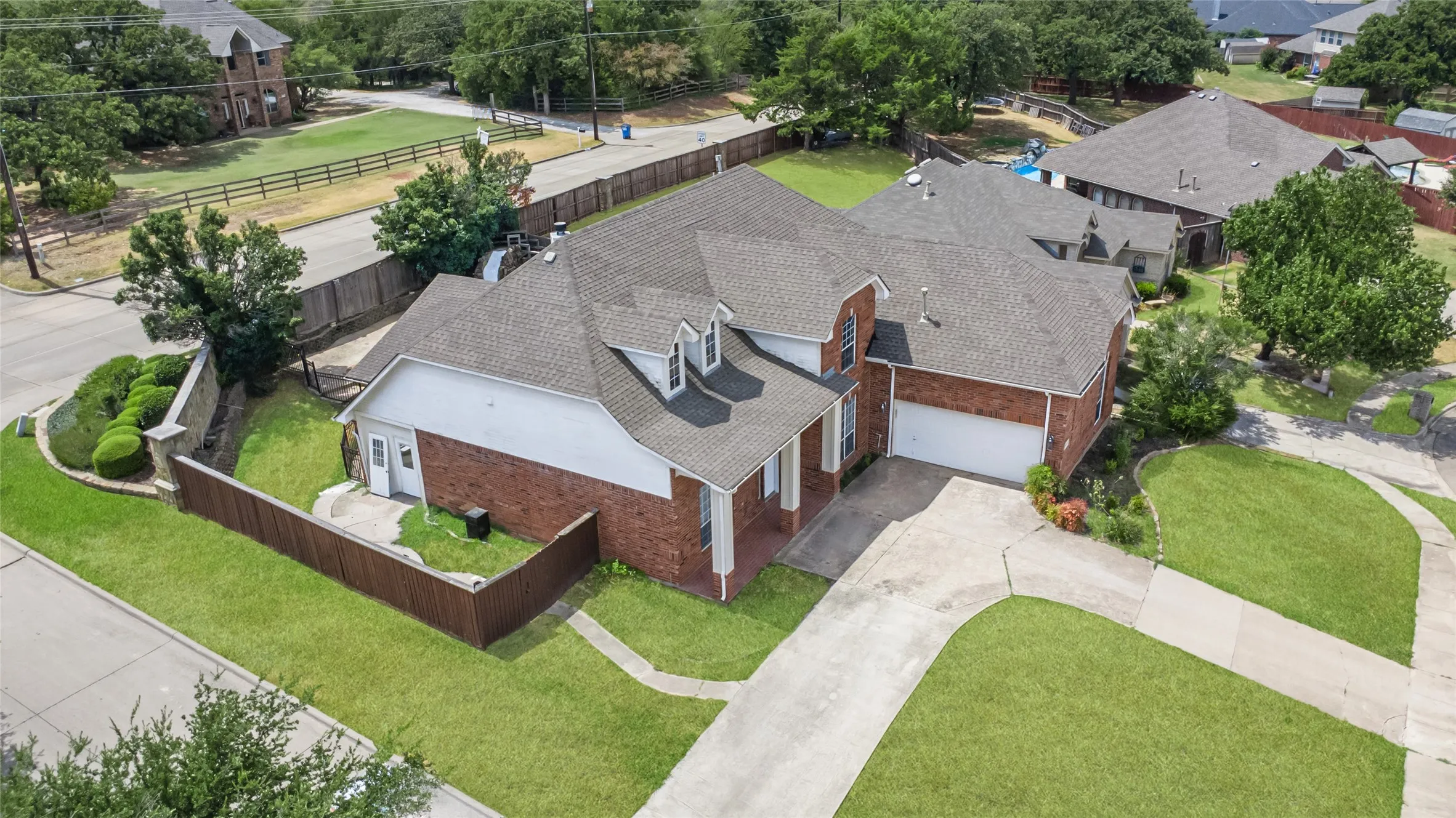 Red brick exterior with white siding accents