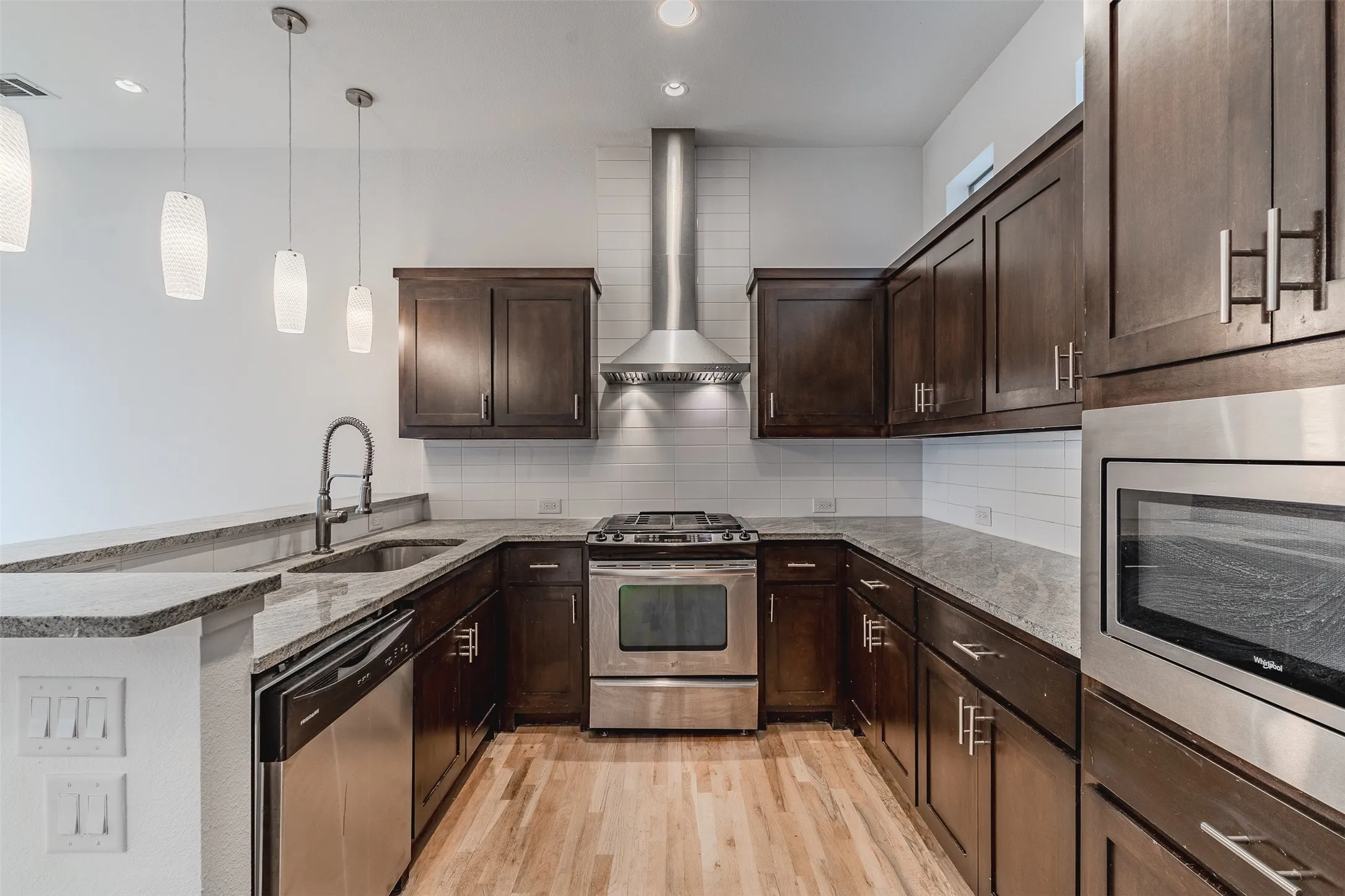 Wood-finish flooring with dark wood cabinetry