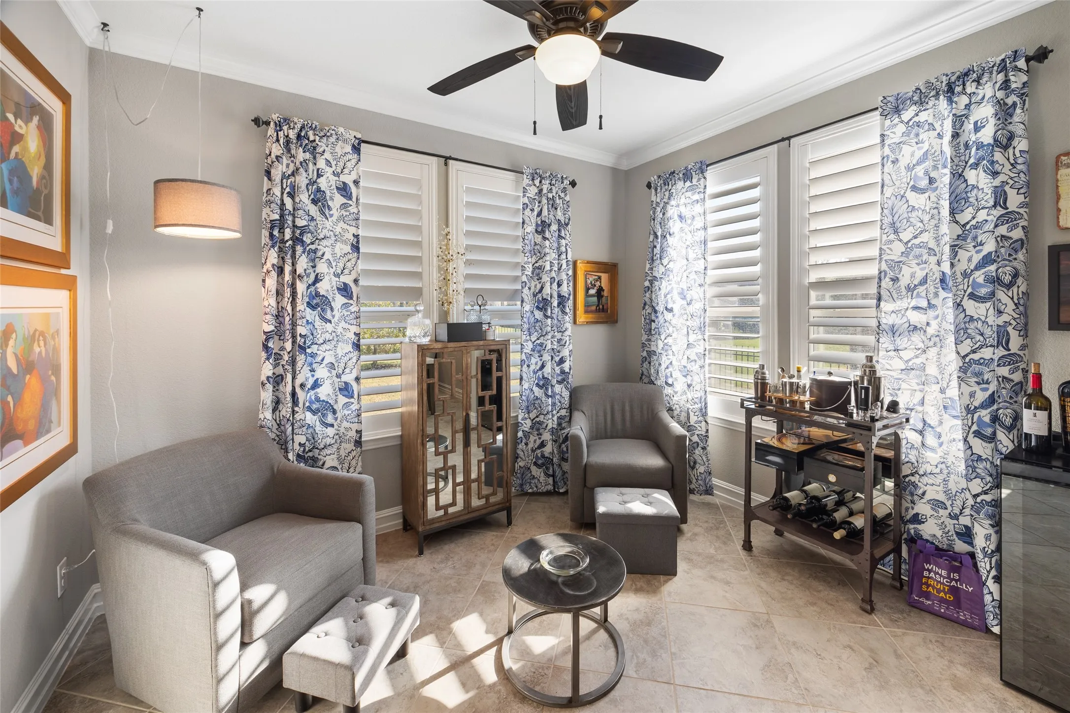 Neutral-toned tile flooring complements the light wall color