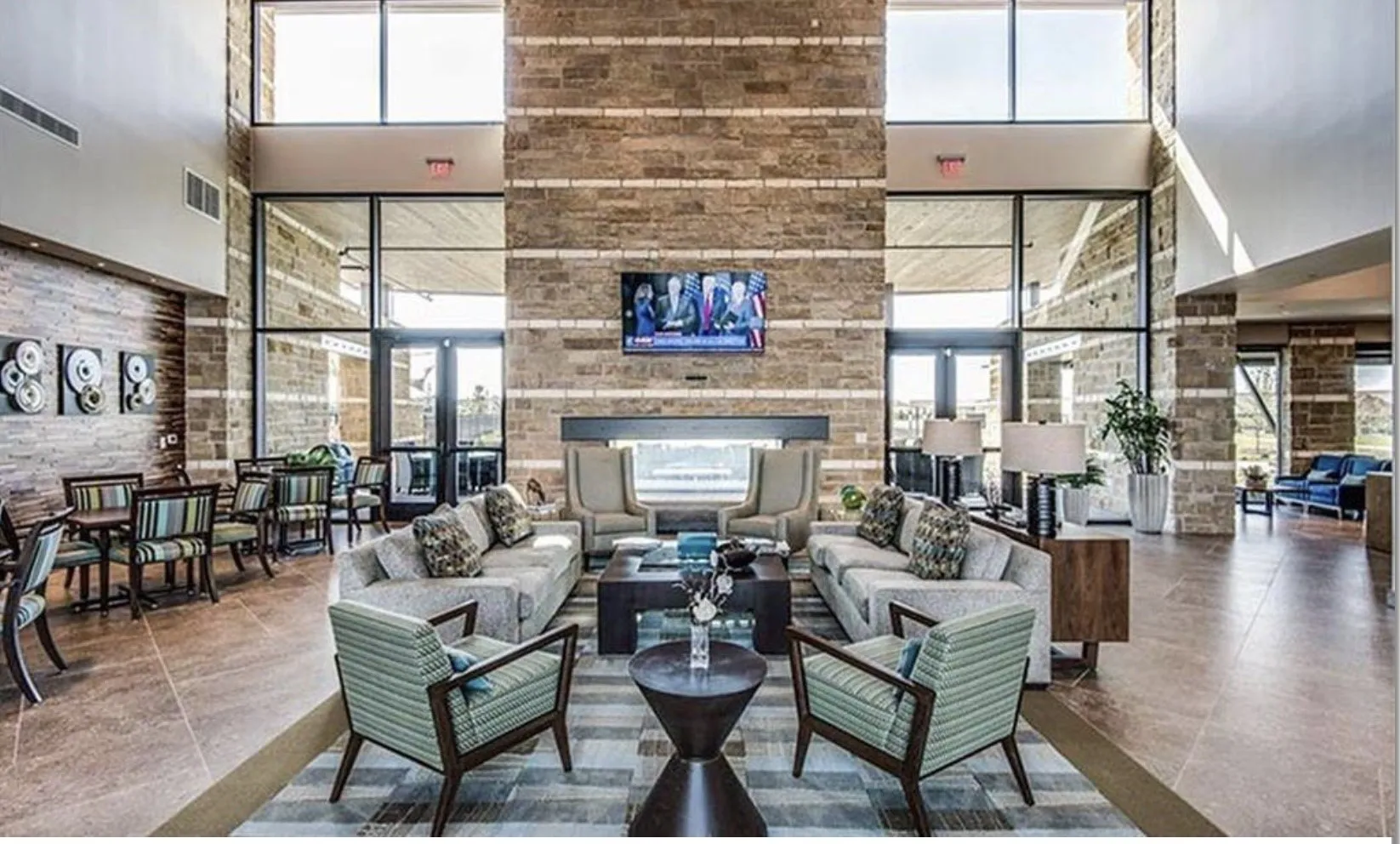 Two-story stone accent wall with integrated fireplace