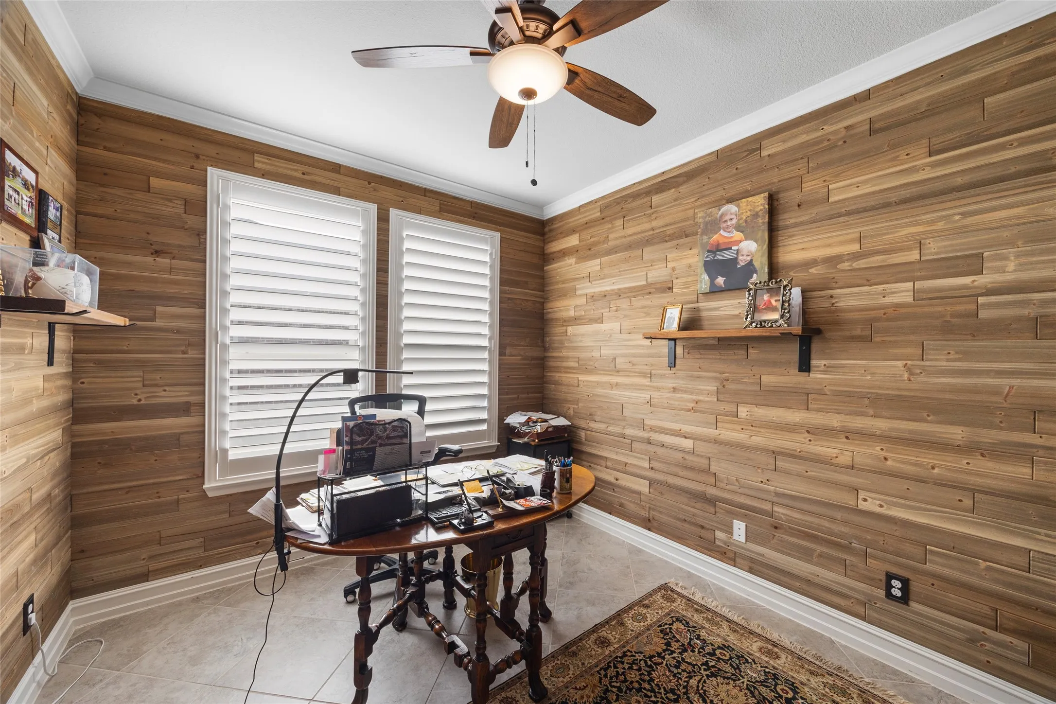 Wood plank accent wall with crown molding