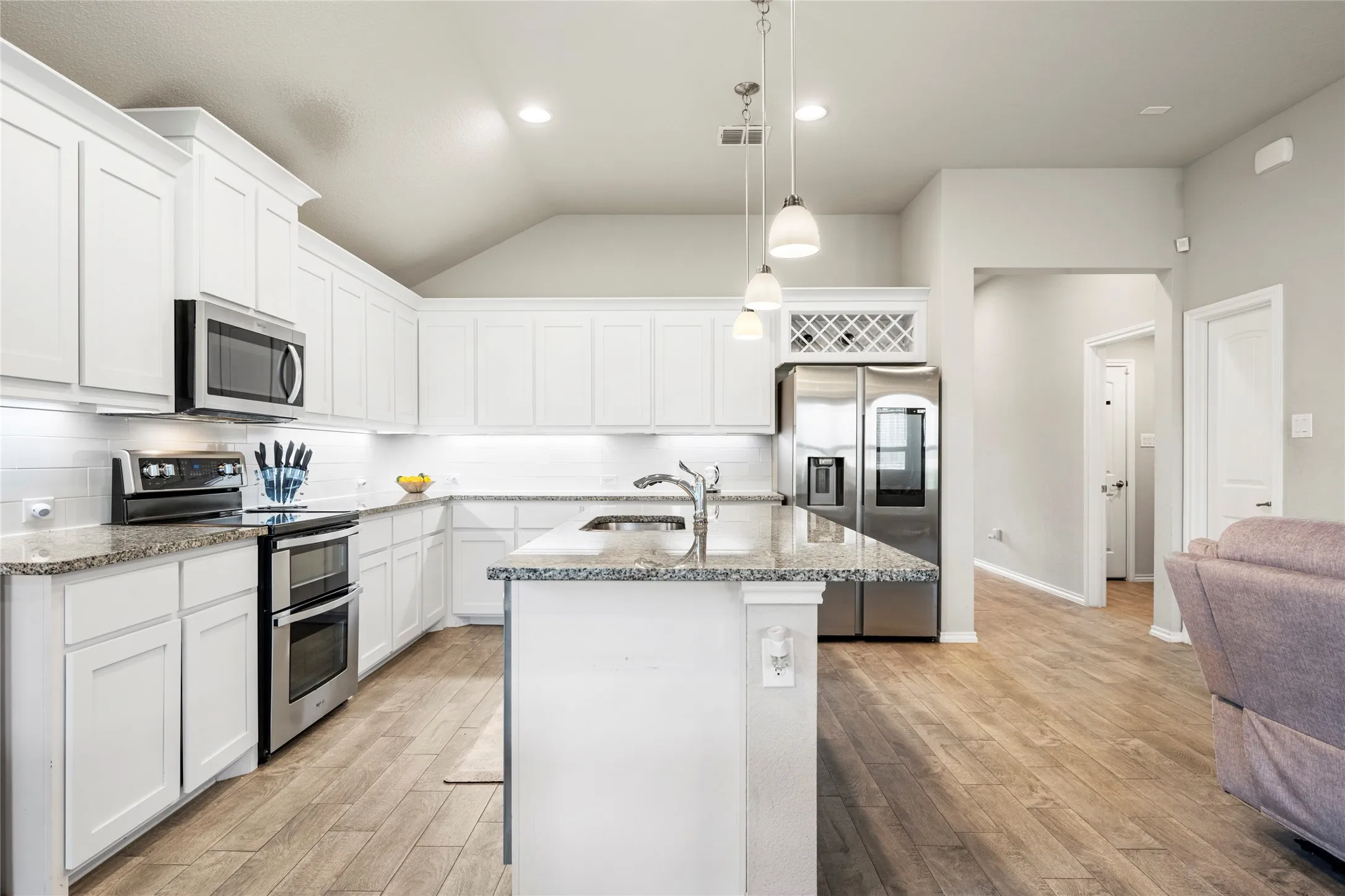 Easy access to kitchen and living area from front door and close proximity to laundry room through that open door on the right....