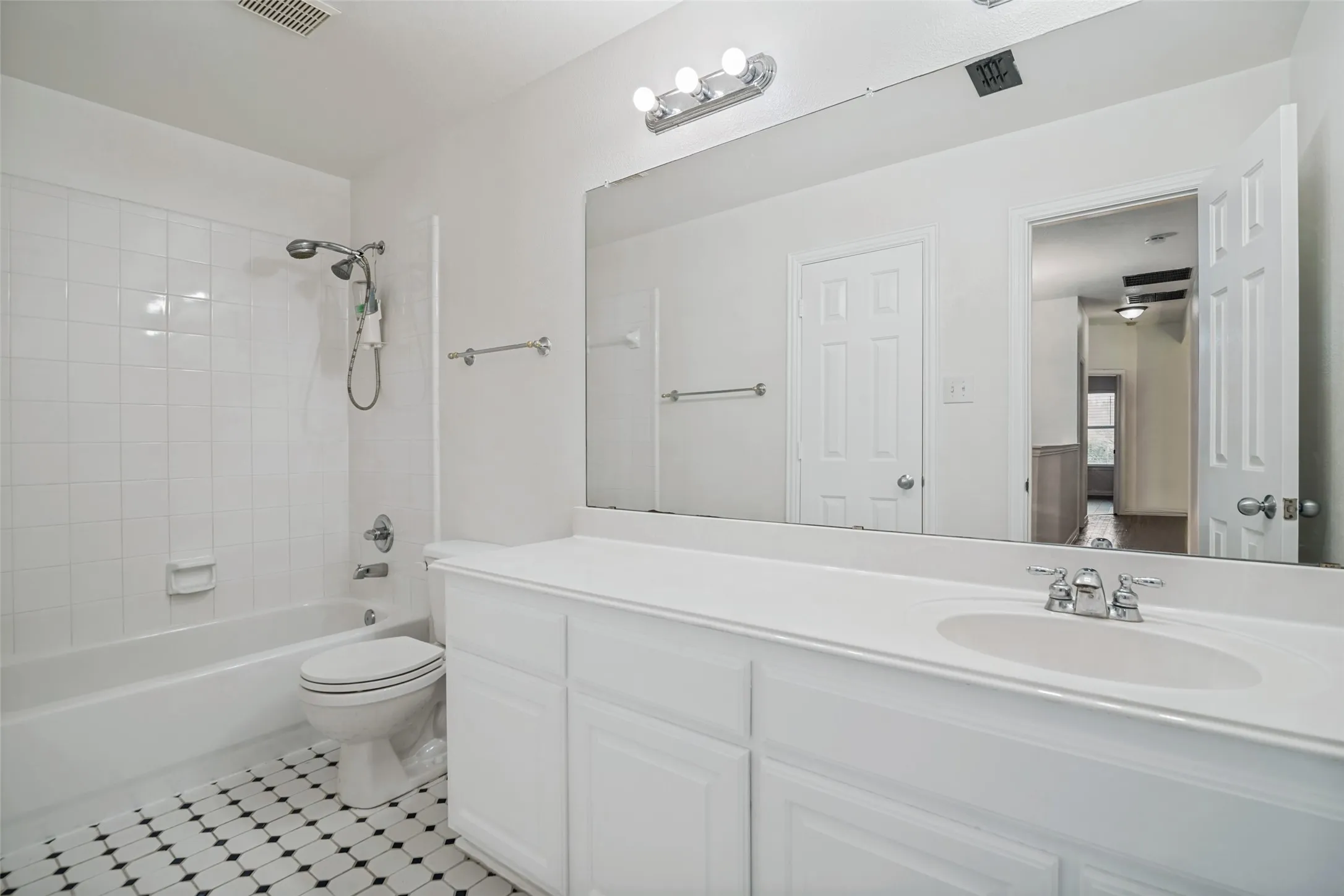 Wood-finish flooring with white baseboards