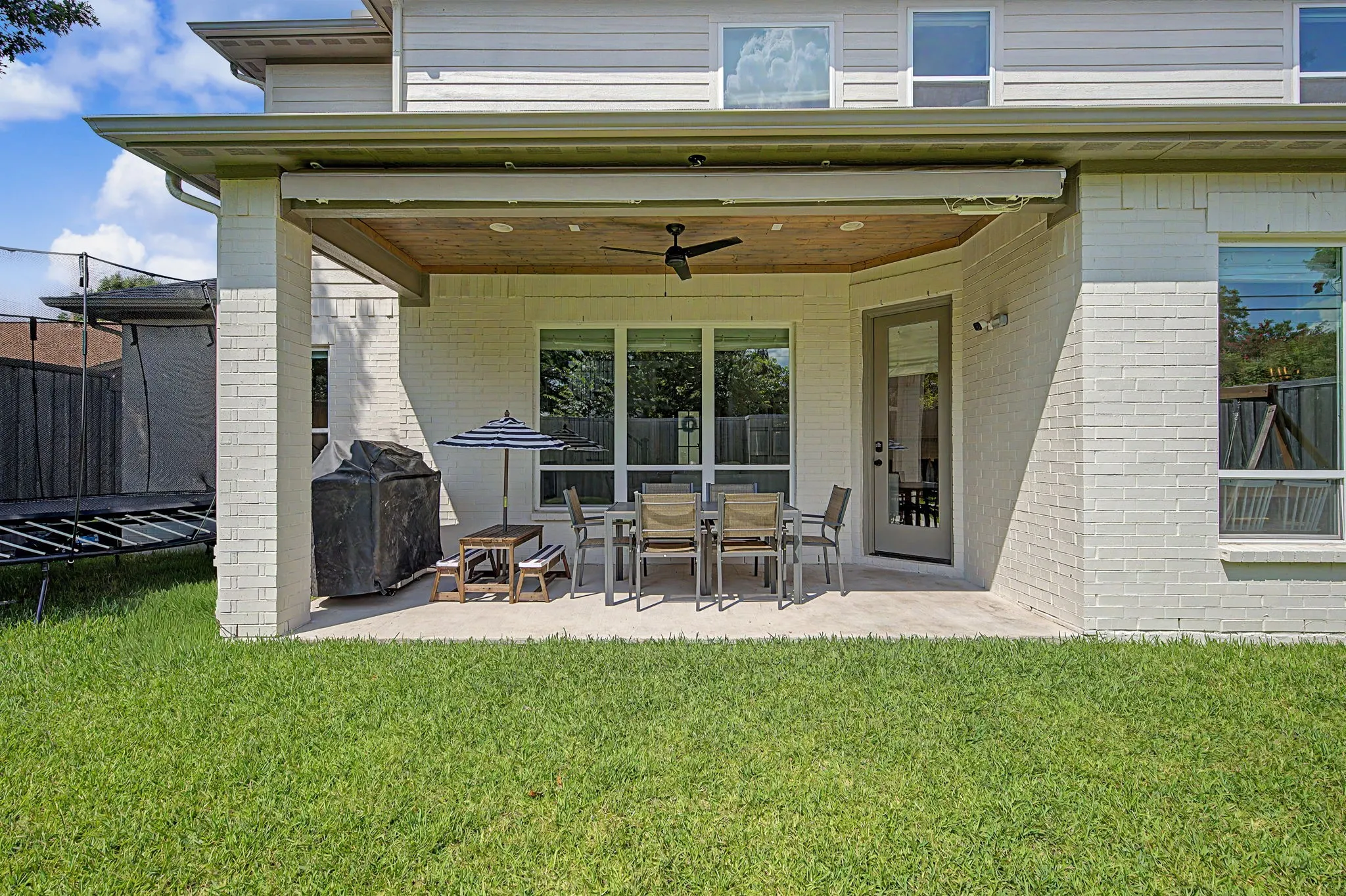 Back porch with retractable sunshade