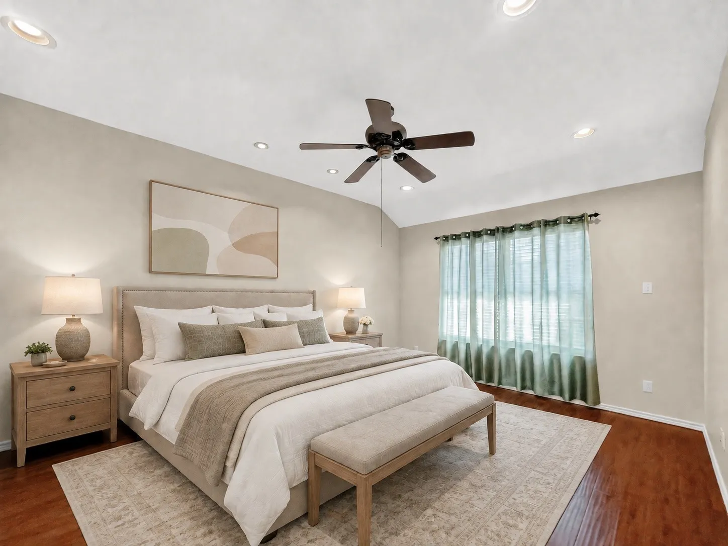 Vaulted ceiling with recessed lighting and a ceiling fan, wood-finish flooring, and a large window with privacy blinds