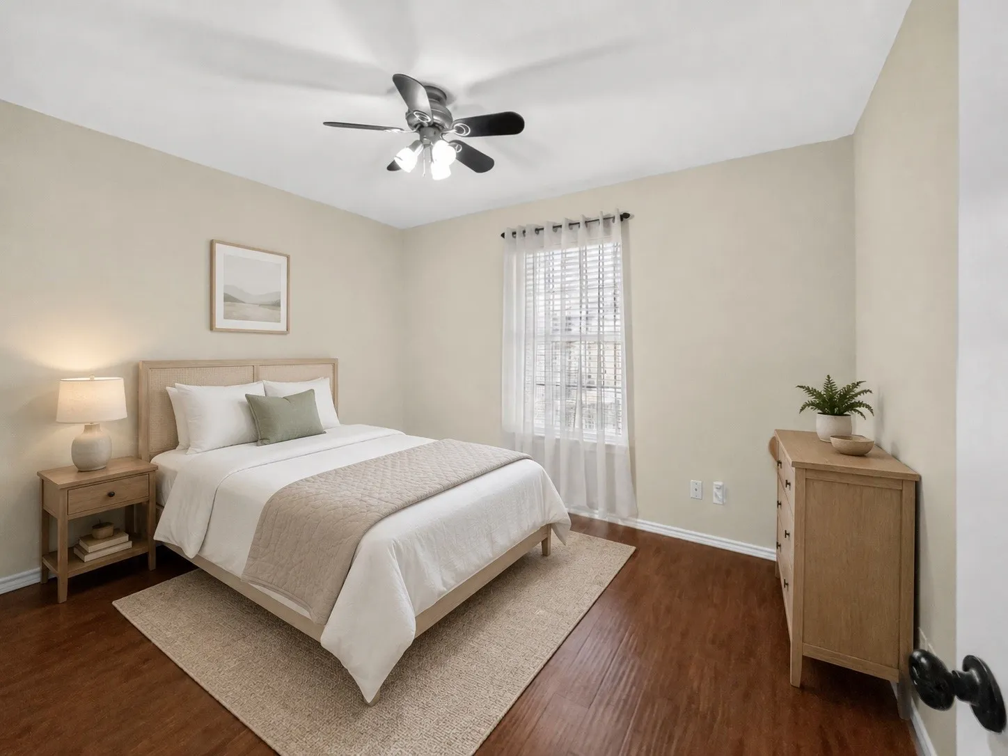 Hardwood-finish flooring, ceiling fan with integrated lighting, and window with blinds