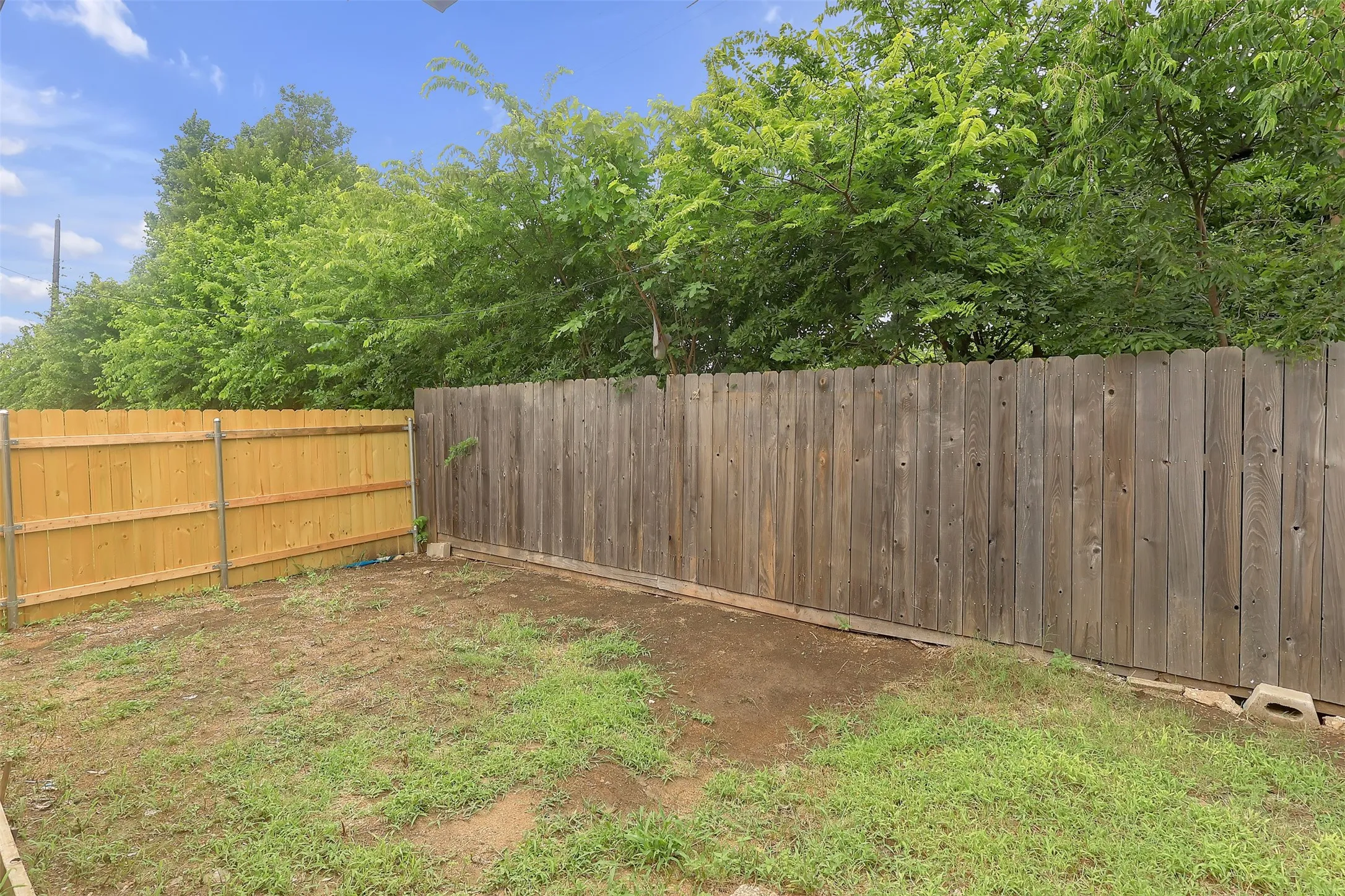 View of fenced backyard
