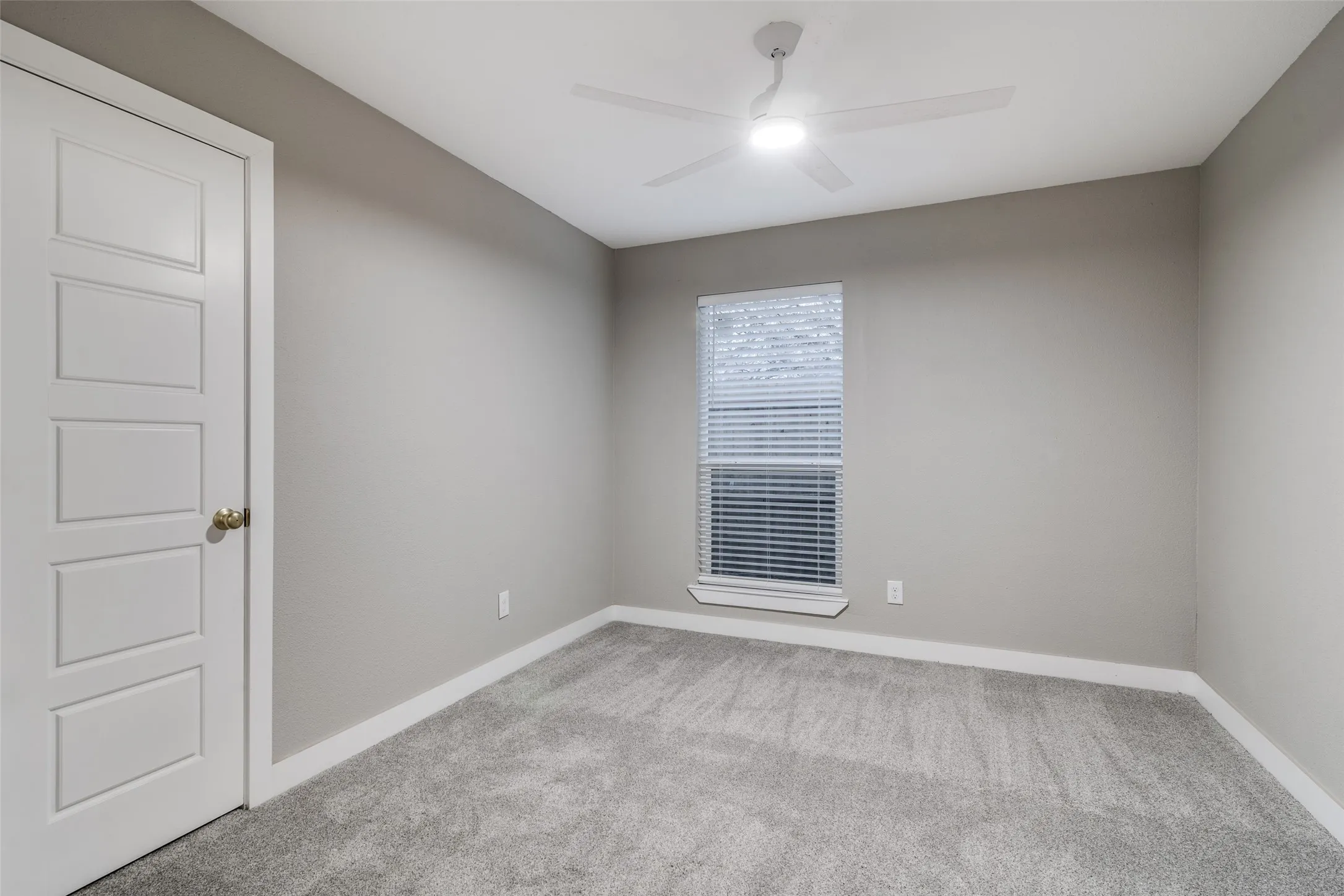 Gray carpeted flooring with white trim