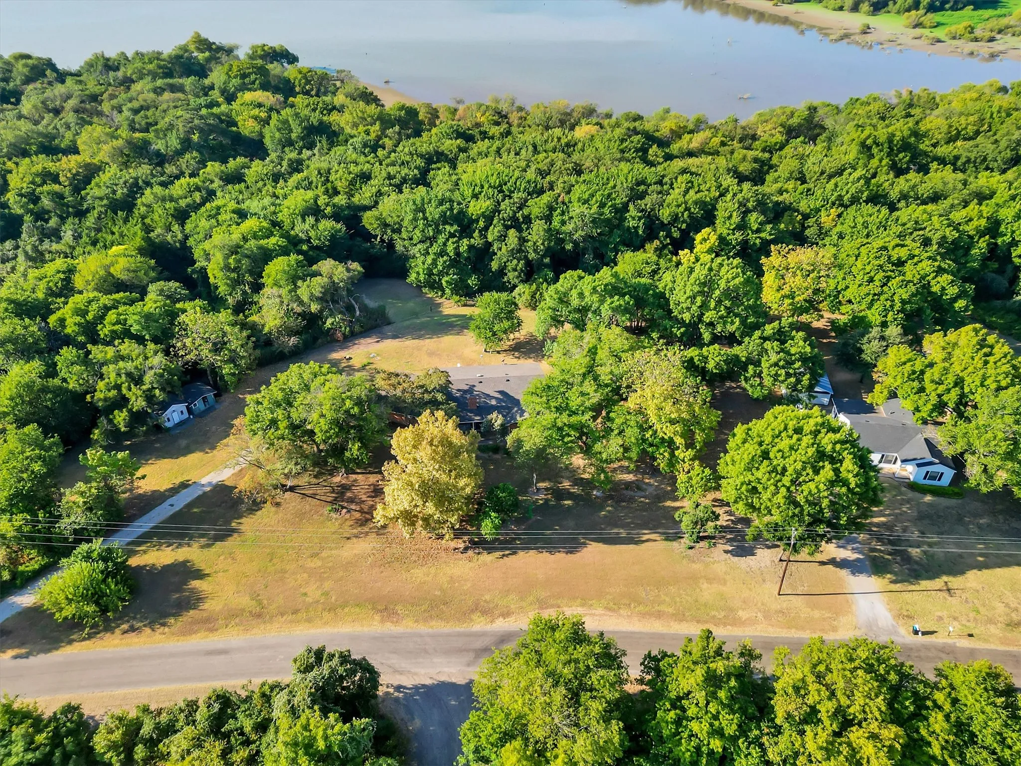 Expansive wooded lot with partial water visibility