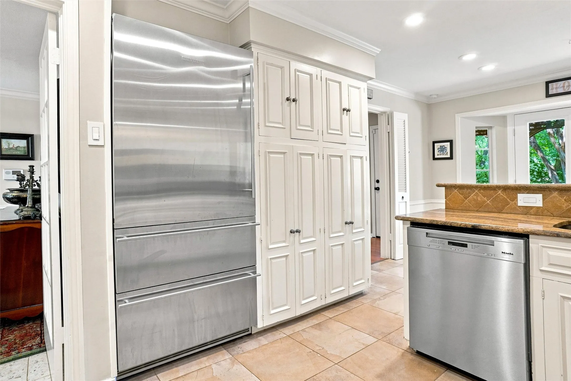 Here you can view the oversized built-in  fridge-freezer and the cabinet style pantry.