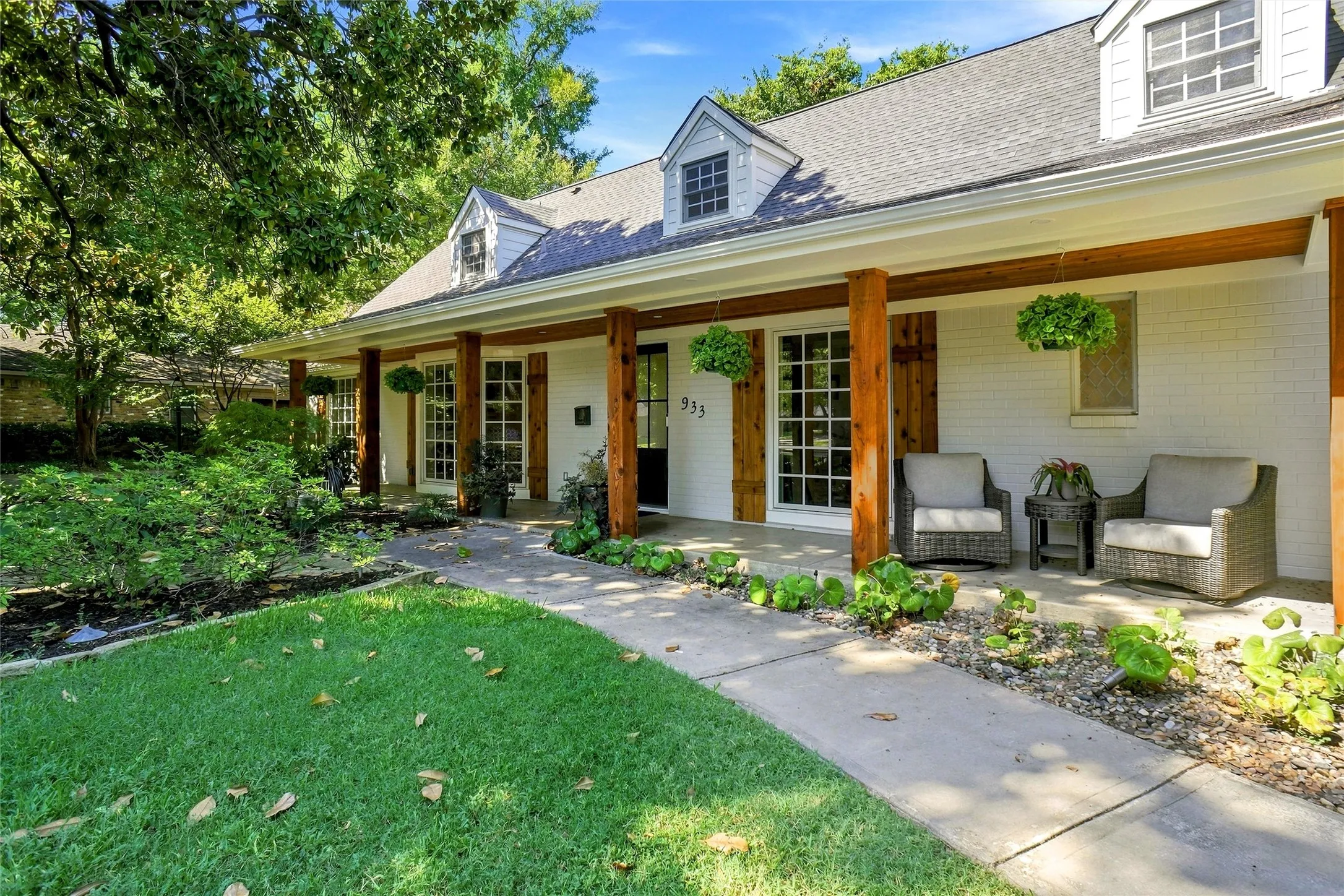 This  home is magnificent with its grand front porch which was just updated to include fresh paint, new LED exterior lighting, cedar wrapped columns, new beautiful front door, and a cedar  beaded ceiling.The exterior has recently been painted and all trim replaced with durable Hardy plank and full gutters added. You need to see the property in person to fully grasp the details and beauty found here in the curb appeal and landscape design.  Just show stopping!